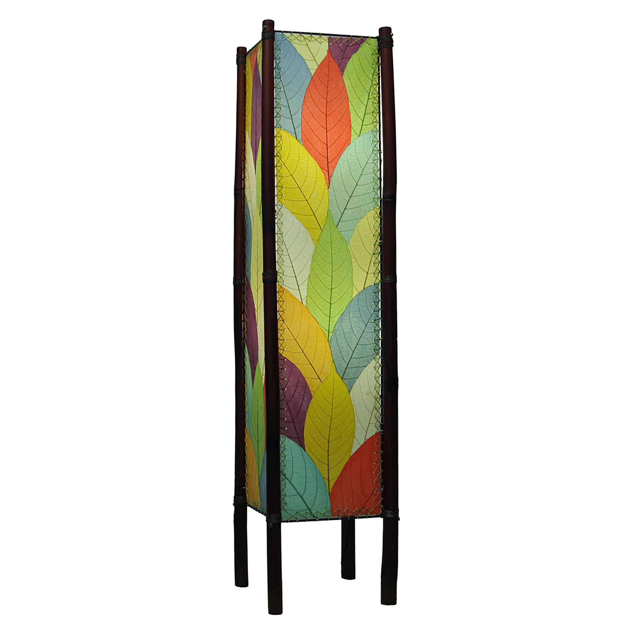 In a quiet bedside corner, crafted by the artisans of Eangee Home Design, the Fortune Large Floor Lamp in multi color stands gracefully, featuring fossilized cocoa leaf shade, abaca rope accents, rattan leg supports, wrought iron frame, handcrafted, adding warmth and character to the space.