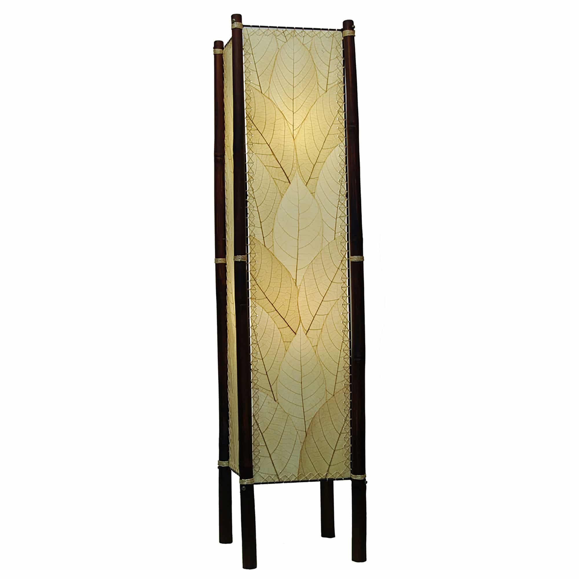 Crafted by the artisans of Eangee Home Design, the Fortune Large Floor Lamp in natural against a clean backdrop, featuring fossilized cocoa leaf shade, abaca rope accents, rattan leg supports, wrought iron frame, handcrafted.