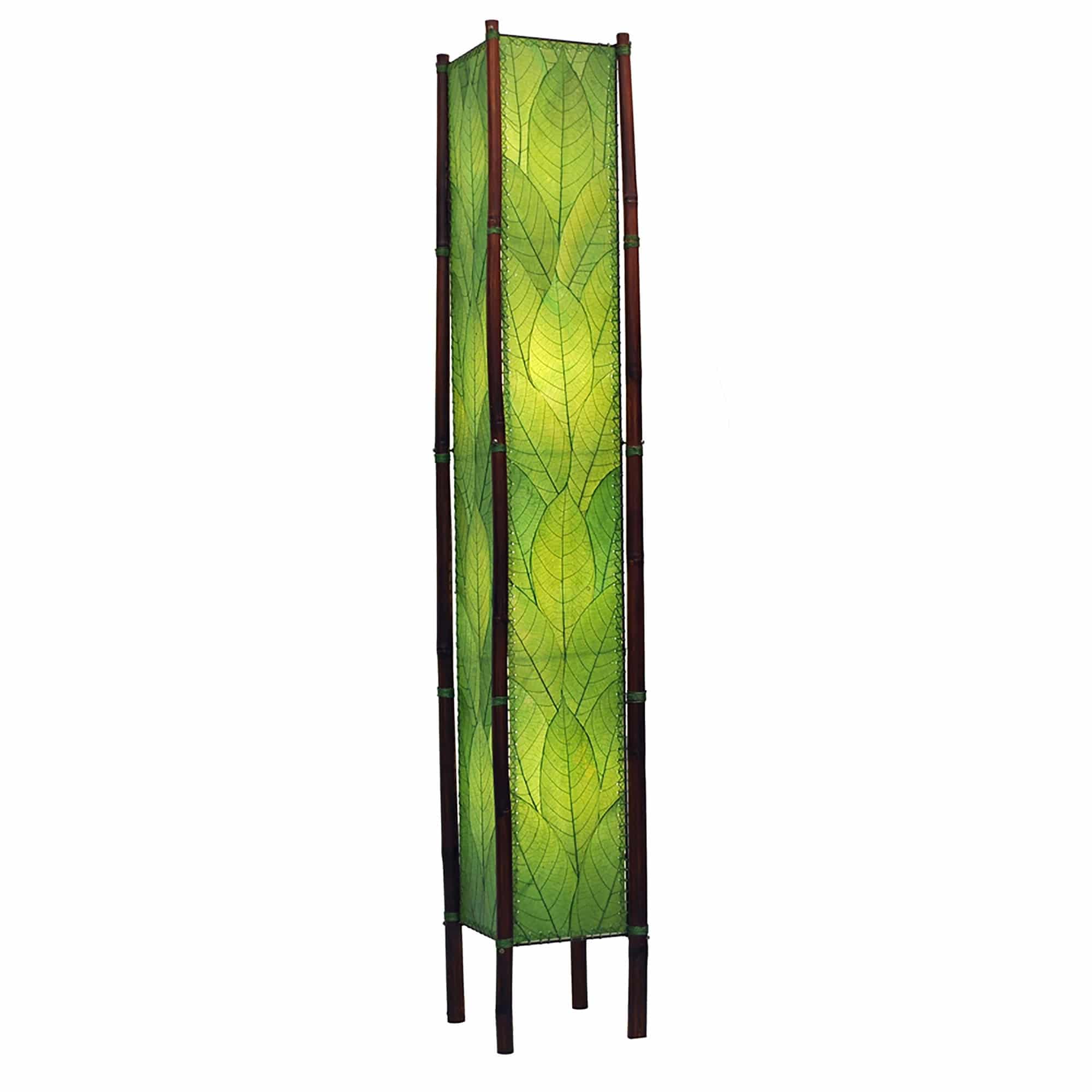 Crafted by the artisans of Eangee Home Design, the Fortune Giant Floor Lamp in green against a clean backdrop, featuring fossilized cocoa leaf shade, abaca rope accents, rattan leg supports, wrought iron frame, eco friendly.