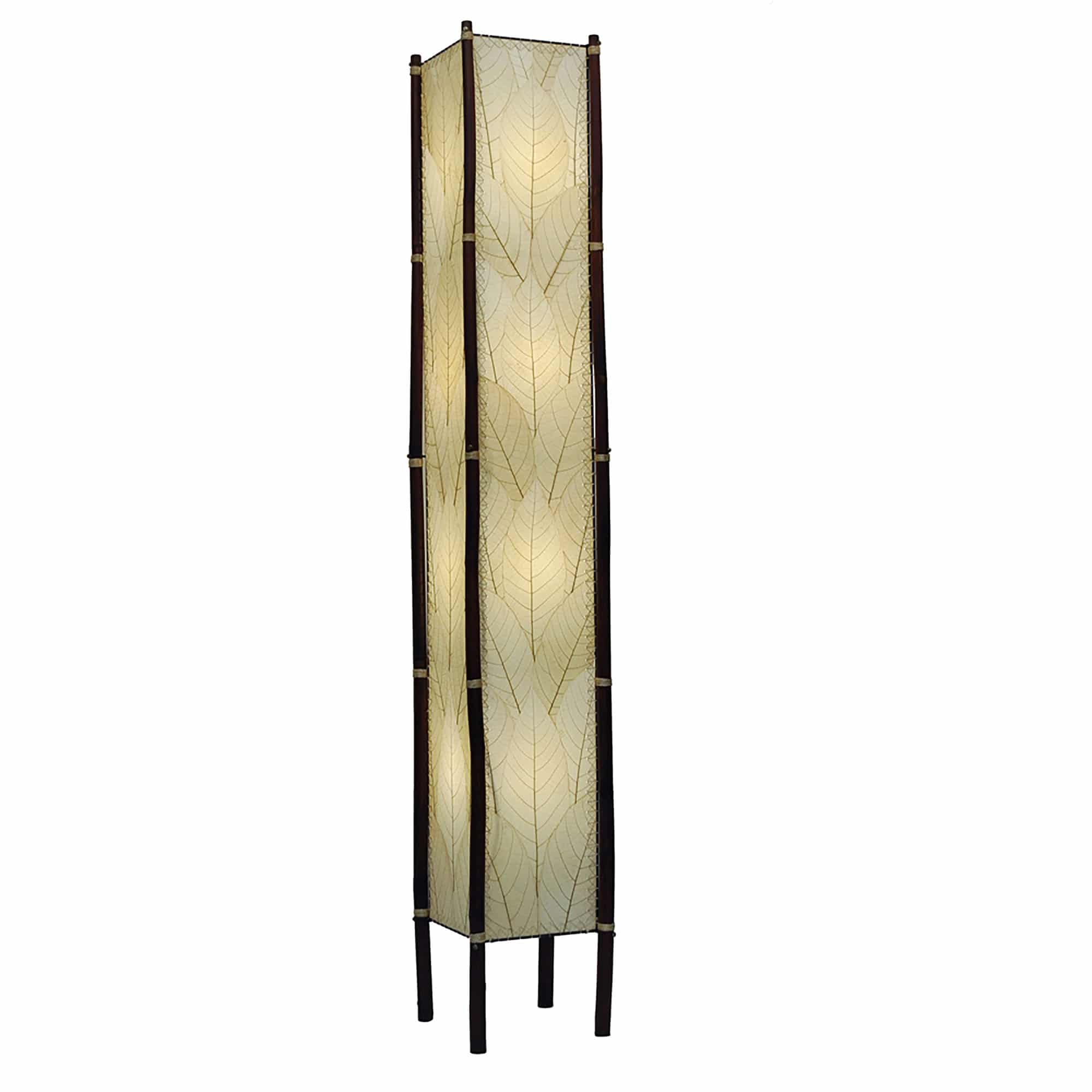 Crafted by the artisans of Eangee Home Design, the Fortune Giant Floor Lamp in natural against a clean backdrop, featuring fossilized cocoa leaf shade, abaca rope accents, rattan leg supports, wrought iron frame, eco friendly.