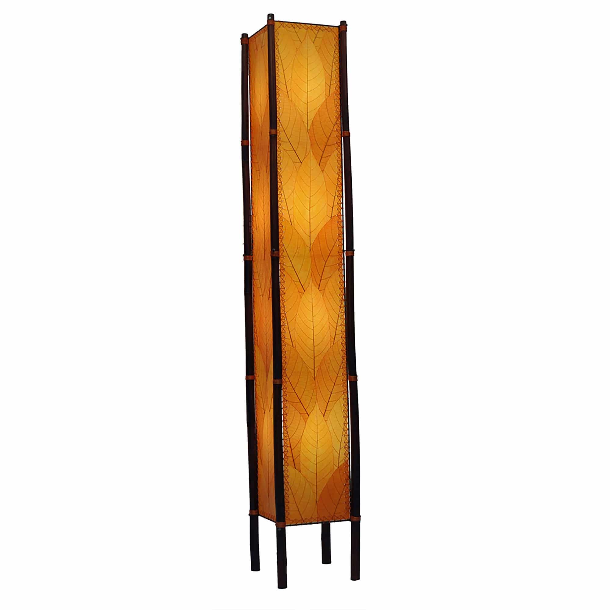 Crafted by the artisans of Eangee Home Design, the Fortune Giant Floor Lamp in orange against a clean backdrop, featuring fossilized cocoa leaf shade, abaca rope accents, rattan leg supports, wrought iron frame, eco friendly.