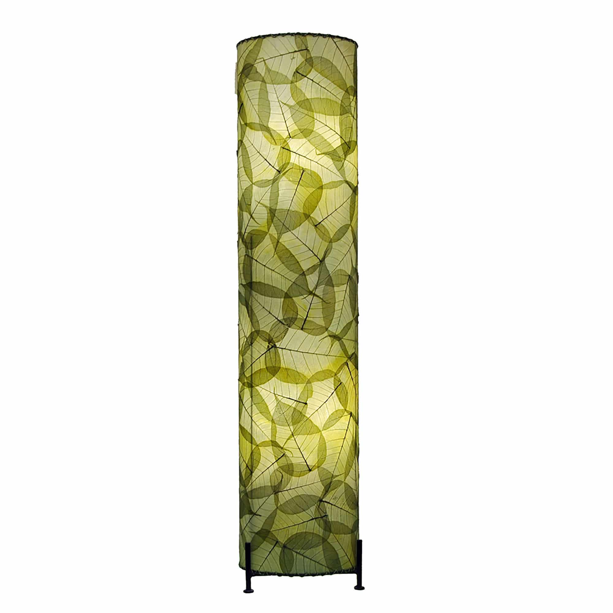 In a minimalist loft with natural textures, crafted by the artisans of Eangee Home Design, the Banyan Large Floor Lamp in green stands gracefully, featuring fossilized cocoa leaf shade, abaca rope accents, wrought iron frame, eco friendly, handcrafted, adding warmth and character to the space.
