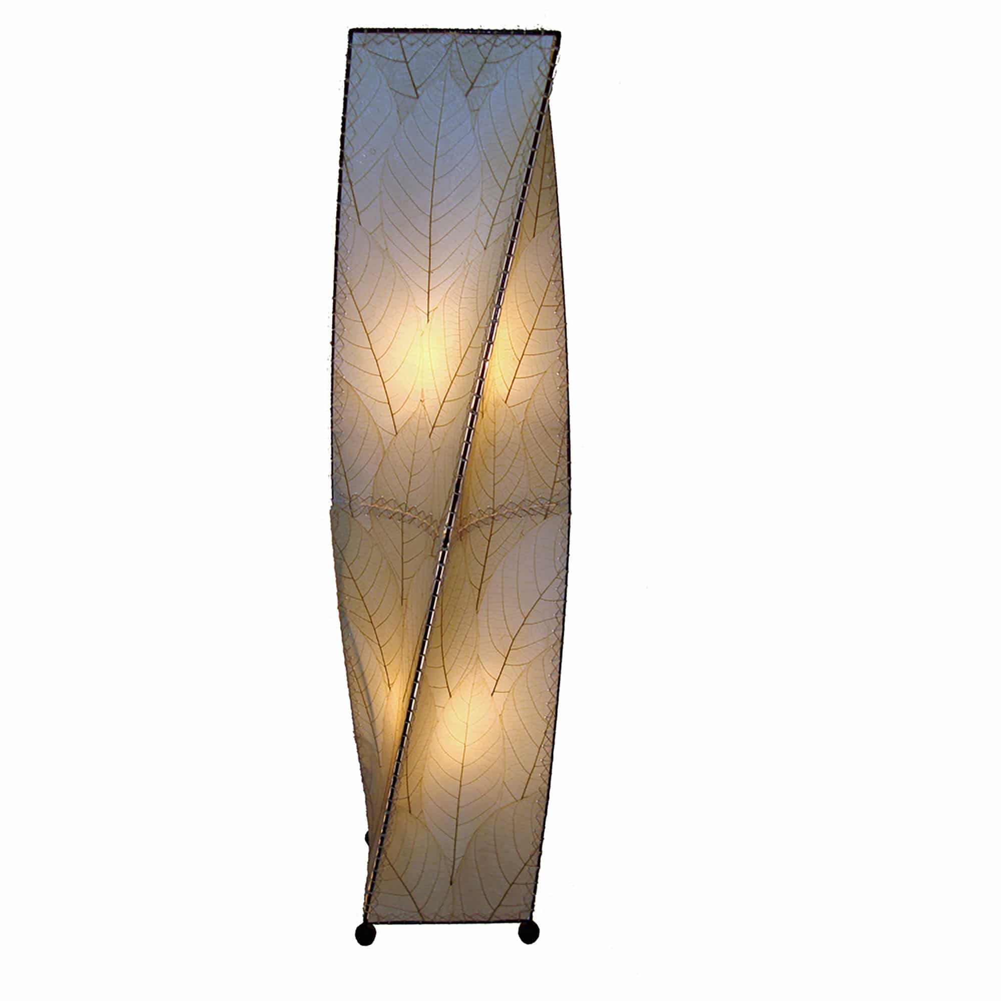 In a minimalist loft with natural textures, crafted by the artisans of Eangee Home Design, the Twist Large Floor Lamp in natural stands gracefully, featuring fossilized cocoa leaf shade, wrought iron frame, sustainably sourced, handcrafted, adding warmth and character to the space.