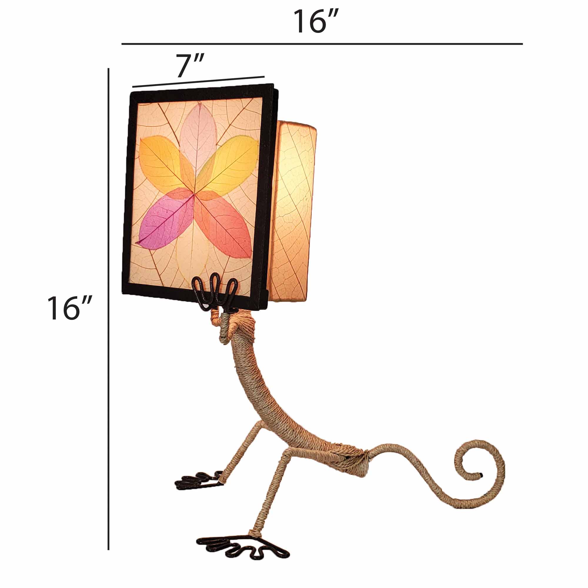 Crafted by the artisans of Eangee Home Design, the Enlightened Gecko Table Lamp in multi color against a clean backdrop, featuring fossilized cocoa leaf shade, guyabano leaf shade, abaca rope accents, wrought iron frame, handcrafted.