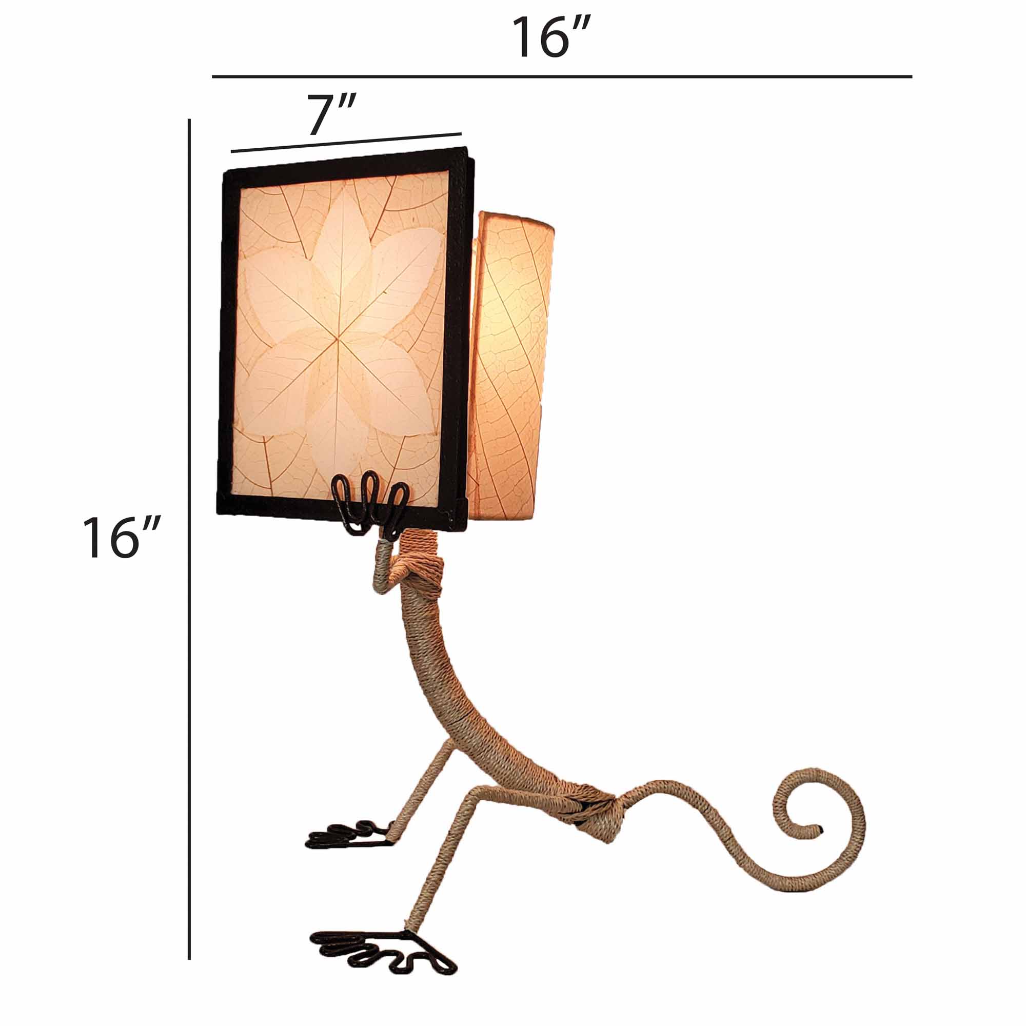 Crafted by the artisans of Eangee Home Design, the Enlightened Gecko Table Lamp in natural against a clean backdrop, featuring fossilized cocoa leaf shade, guyabano leaf shade, abaca rope accents, wrought iron frame, handcrafted.