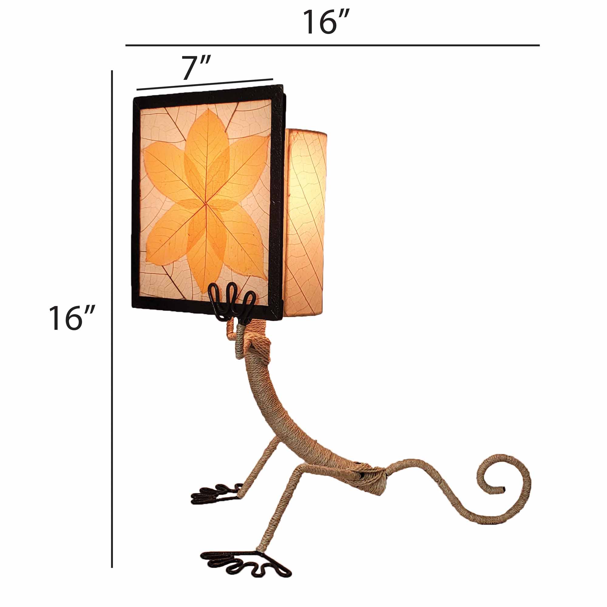 Crafted by the artisans of Eangee Home Design, the Enlightened Gecko Table Lamp in orange against a clean backdrop, featuring fossilized cocoa leaf shade, guyabano leaf shade, abaca rope accents, wrought iron frame, handcrafted.