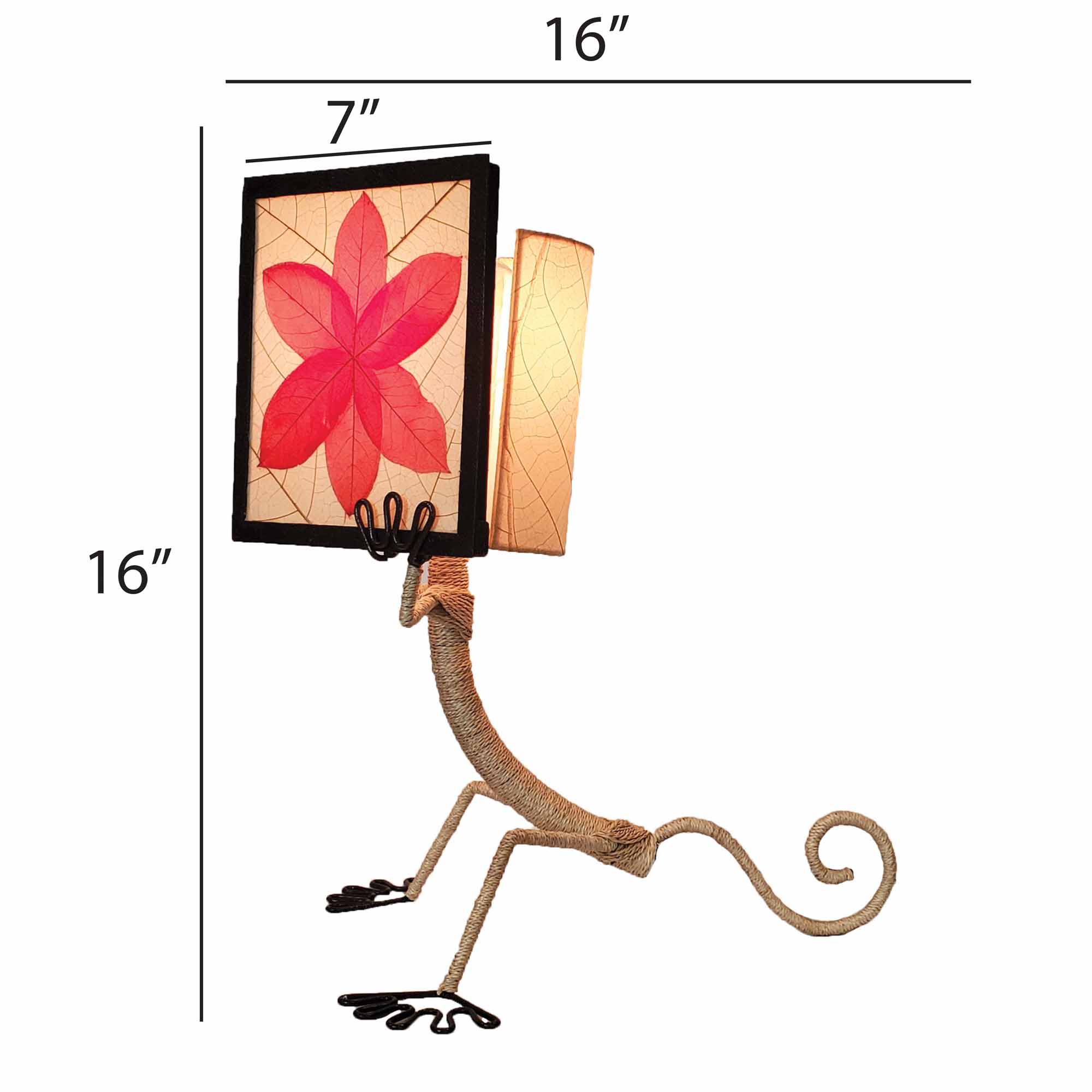 Crafted by the artisans of Eangee Home Design, the Enlightened Gecko Table Lamp in red against a clean backdrop, featuring fossilized cocoa leaf shade, guyabano leaf shade, abaca rope accents, wrought iron frame, handcrafted.