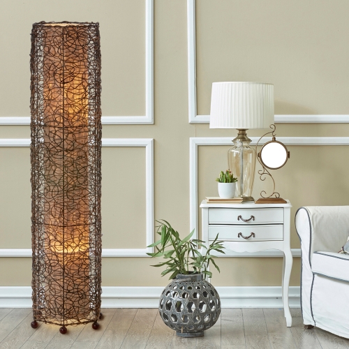 In a coastal inspired living room, crafted by the artisans of Eangee Home Design, the Nito Large Floor Lamp in natural stands gracefully, featuring recycled paper shade, eco friendly, recycled materials, adding warmth and character to the space.