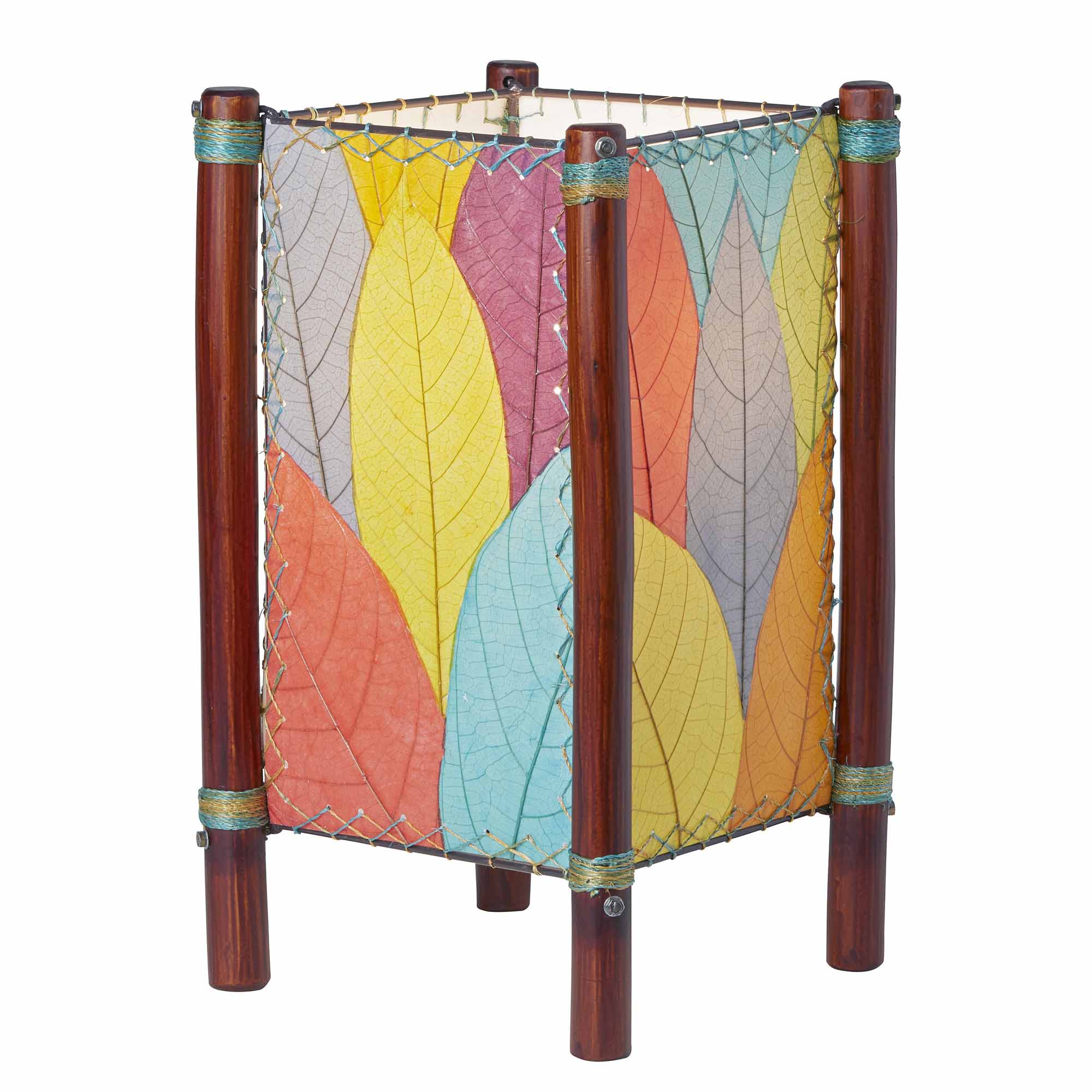 Crafted by the artisans of Eangee Home Design, the Fortune Table Lamp in multi color against a clean backdrop, featuring fossilized cocoa leaf shade, abaca rope accents, rattan leg supports.