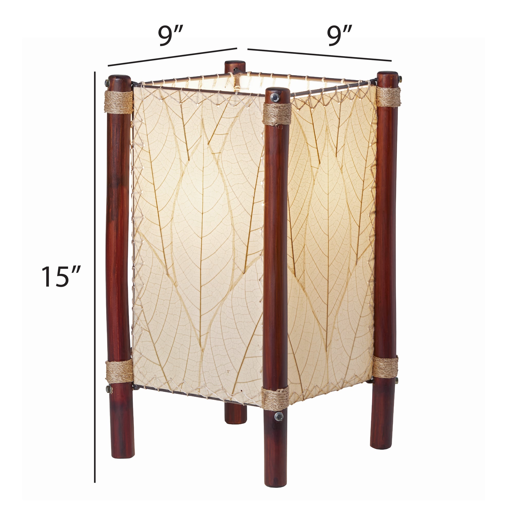 Crafted by the artisans of Eangee Home Design, the Fortune Table Lamp in natural against a clean backdrop, featuring fossilized cocoa leaf shade, abaca rope accents, rattan leg supports.