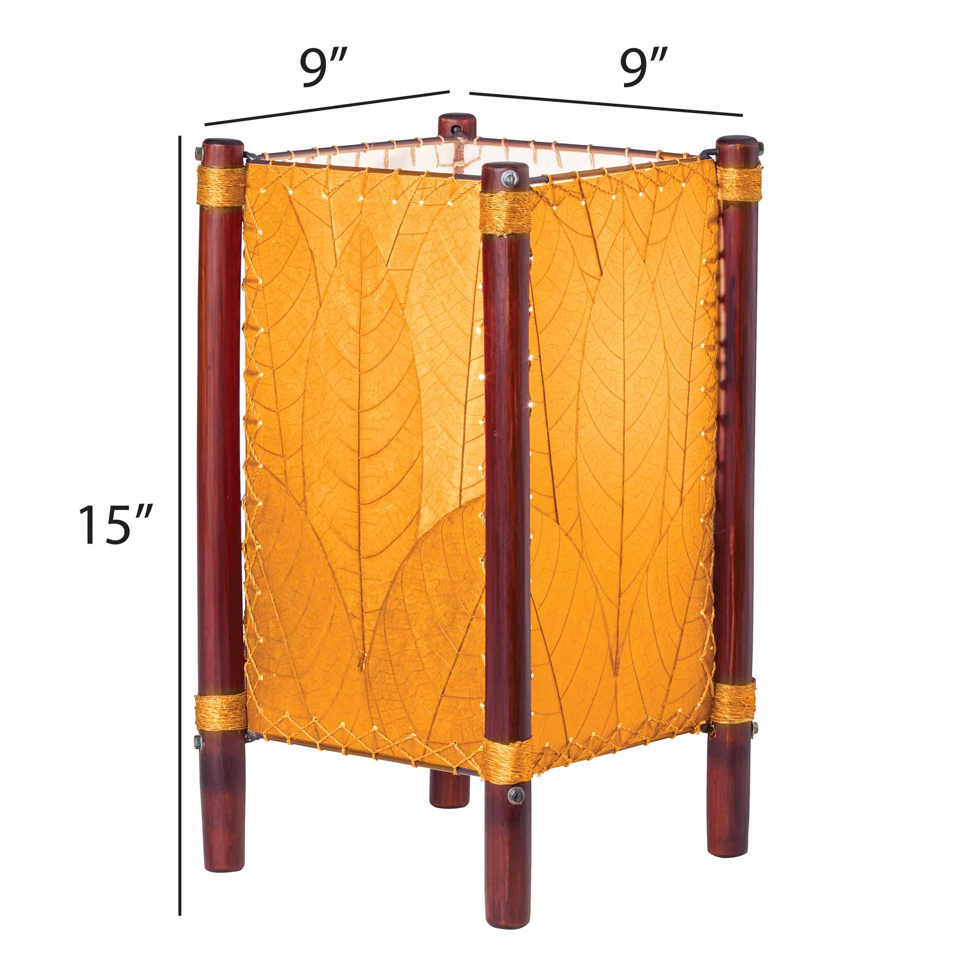 Crafted by the artisans of Eangee Home Design, the Fortune Table Lamp in orange against a clean backdrop, featuring fossilized cocoa leaf shade, abaca rope accents, rattan leg supports.