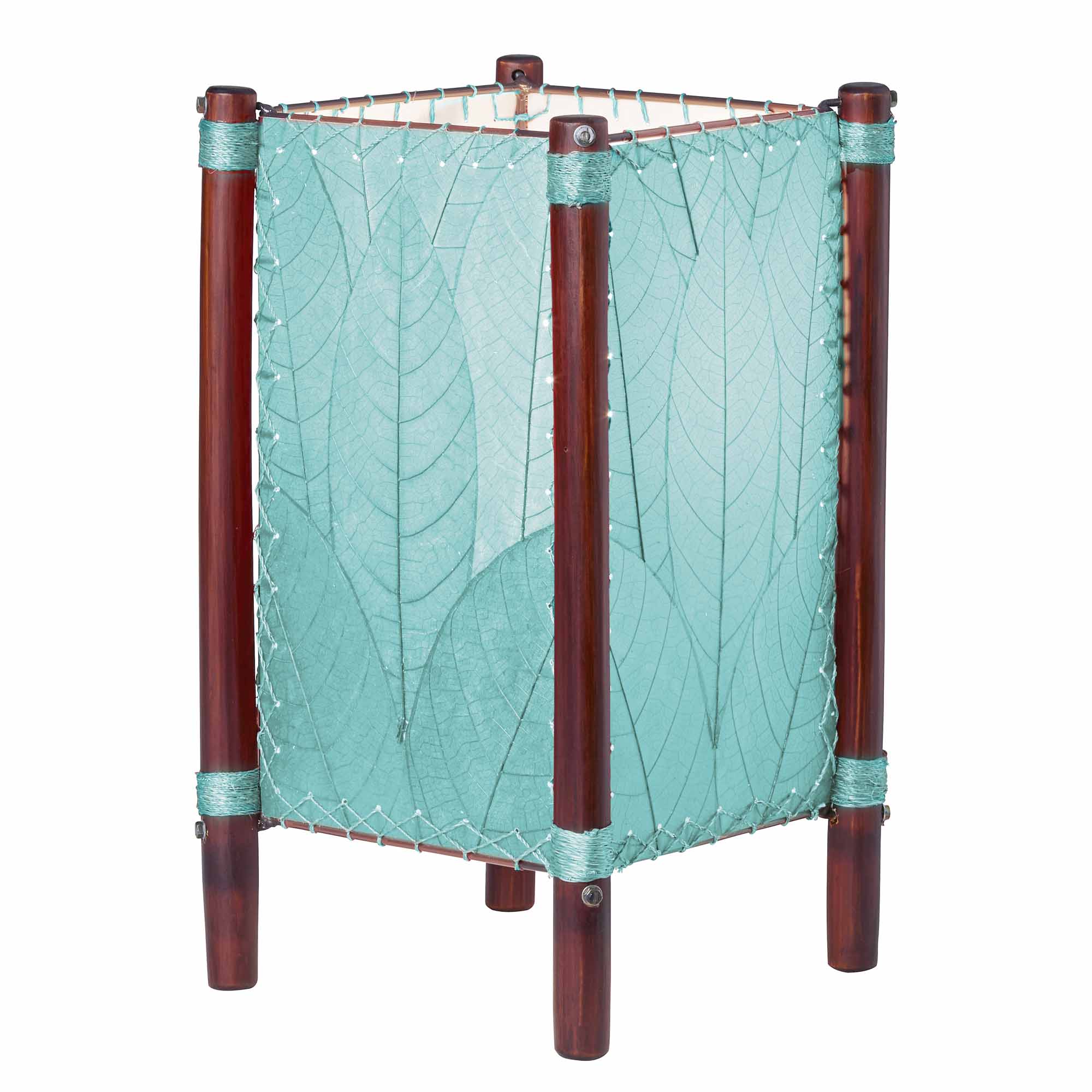 Crafted by the artisans of Eangee Home Design, the Fortune Table Lamp in sea blue against a clean backdrop, featuring fossilized cocoa leaf shade, abaca rope accents, rattan leg supports.