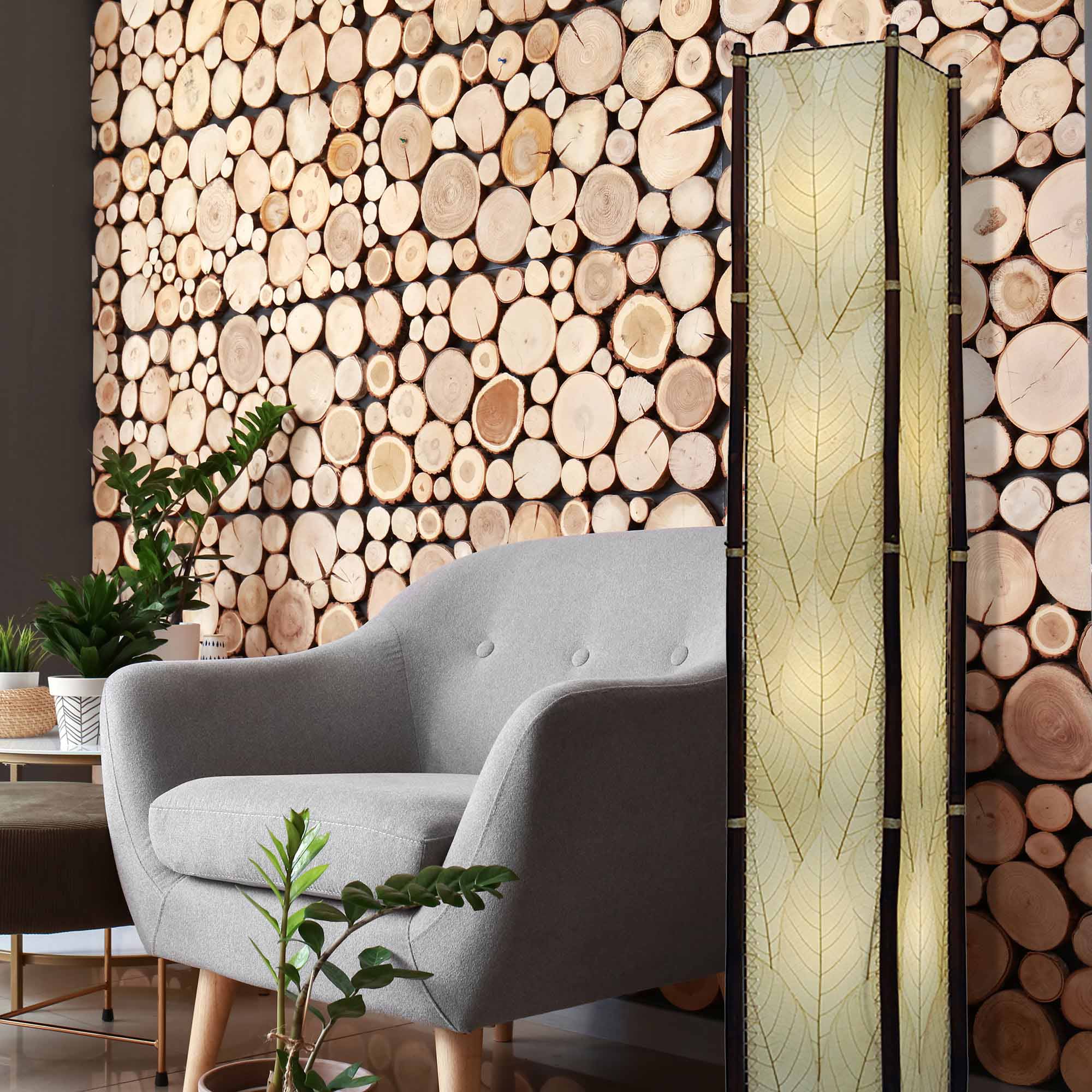 In a minimalist loft with natural textures, crafted by the artisans of Eangee Home Design, the Fortune Giant Floor Lamp in natural stands gracefully, featuring fossilized cocoa leaf shade, abaca rope accents, rattan leg supports, wrought iron frame, eco friendly, adding warmth and character to the space.