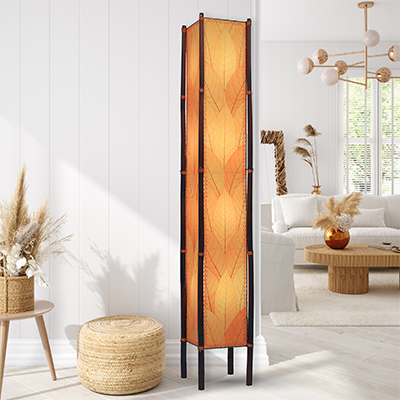 In a modern interior with earth tones, crafted by the artisans of Eangee Home Design, the Fortune Giant Floor Lamp in orange stands gracefully, featuring fossilized cocoa leaf shade, abaca rope accents, rattan leg supports, wrought iron frame, eco friendly, adding warmth and character to the space.