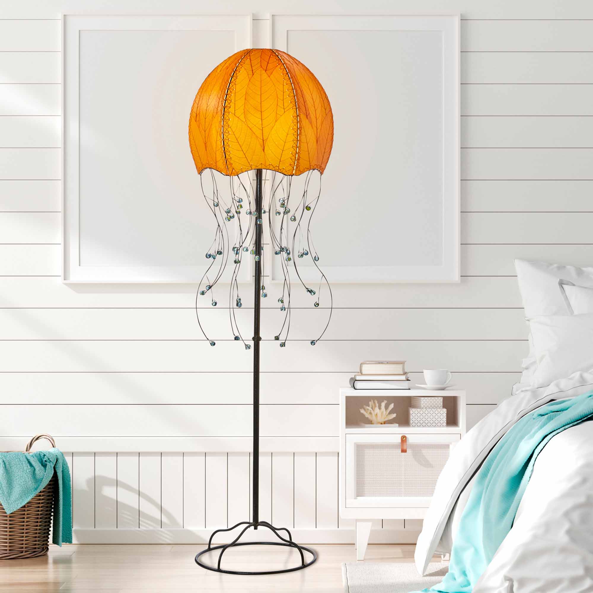 Crafted by the artisans of Eangee Home Design, the Jellyfish Large Floor Lamp in orange against a clean backdrop, featuring fossilized cocoa leaf shade, wrought iron frame, eco friendly.