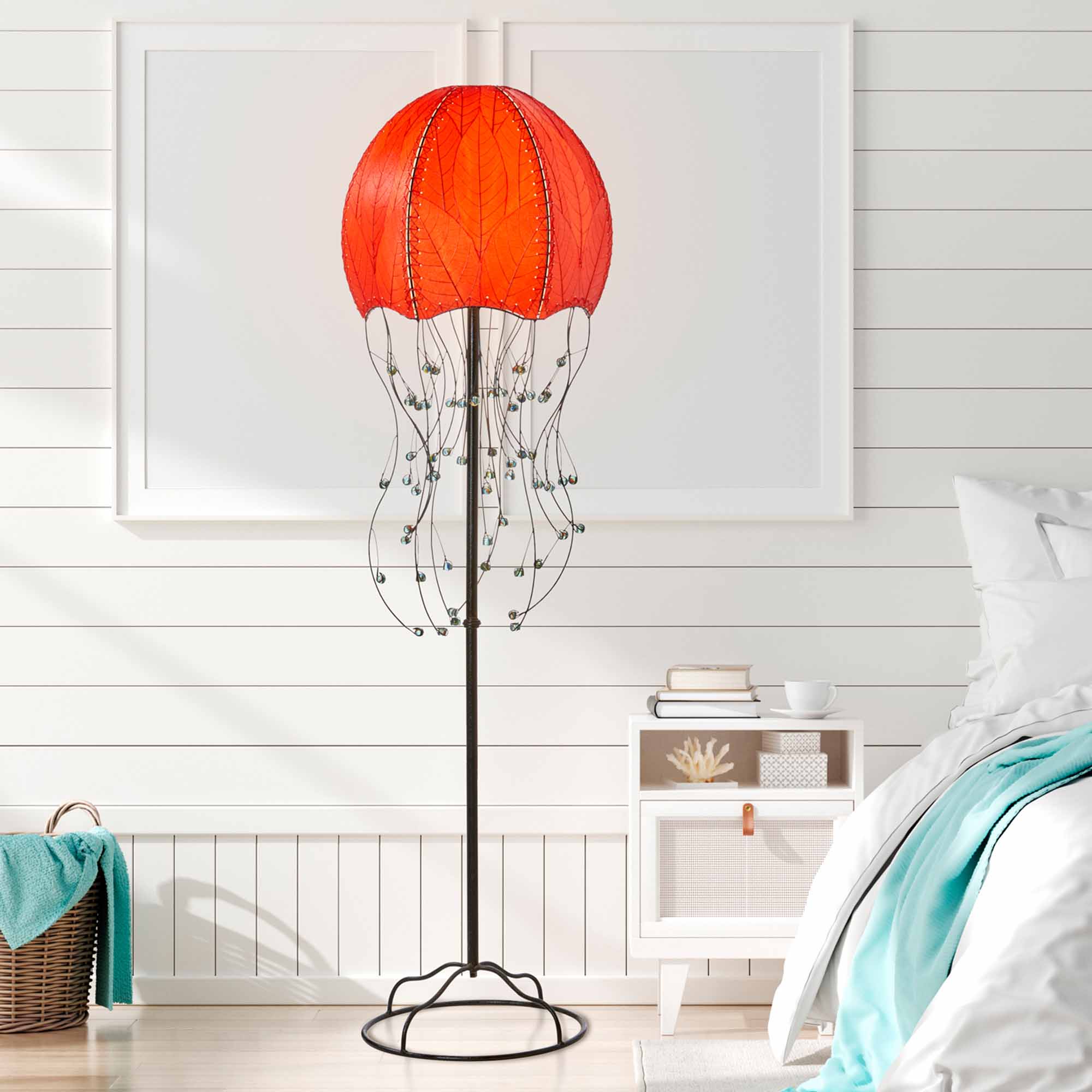 Crafted by the artisans of Eangee Home Design, the Jellyfish Large Floor Lamp in red against a clean backdrop, featuring fossilized cocoa leaf shade, wrought iron frame, eco friendly.
