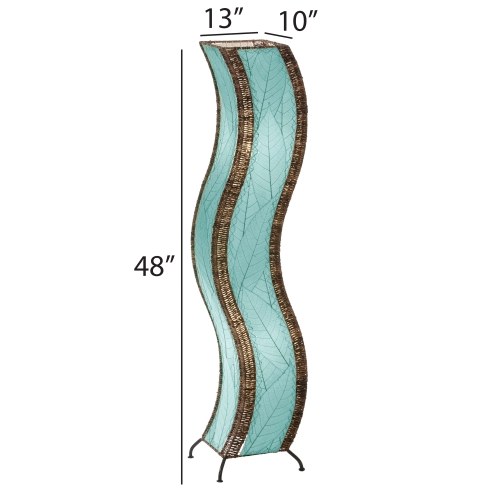 The Eangee Home Design Wave Large Floor Lamp Sea Blue (item #457 l sb), with brown accents, stands on a wooden platform in a modern room beside a green plant and minimalist shelves, adding soothing motion and calm to the space.