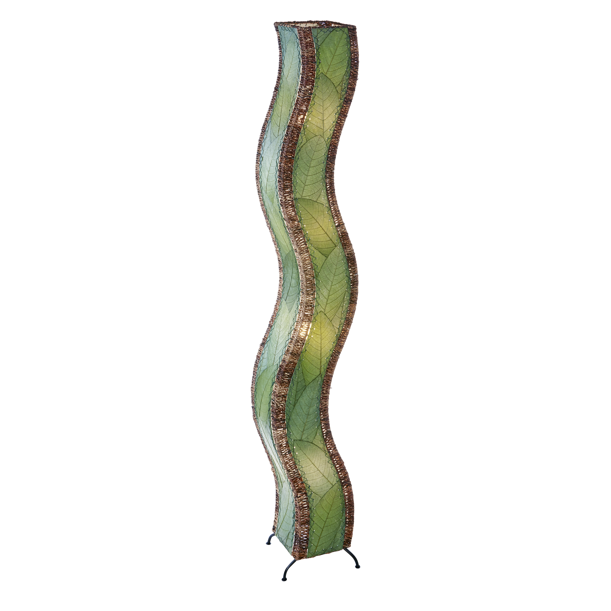 In a modern living room, the Wave Giant Floor crafted by the artisans of Eangee Home Design Lamp in green finish by Eangee Home Design stands tall, its fossilized cocoa leaf panels, abaca twine accents, and hand placed natural leaves casting a warm glow that some designs don't just decorate a space they shape the way it moves.