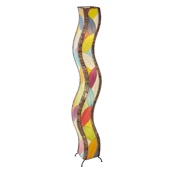 In a sunlit corner of a loft, the Wave Giant Floor crafted by the artisans of Eangee Home Design Lamp in multi color finish by Eangee Home Design stands beside a ceramic vase, its fossilized cocoa leaf panels, abaca twine accents, and hand placed natural leaves casting a warm glow that some designs don't just decorate a space they shape the way it moves.