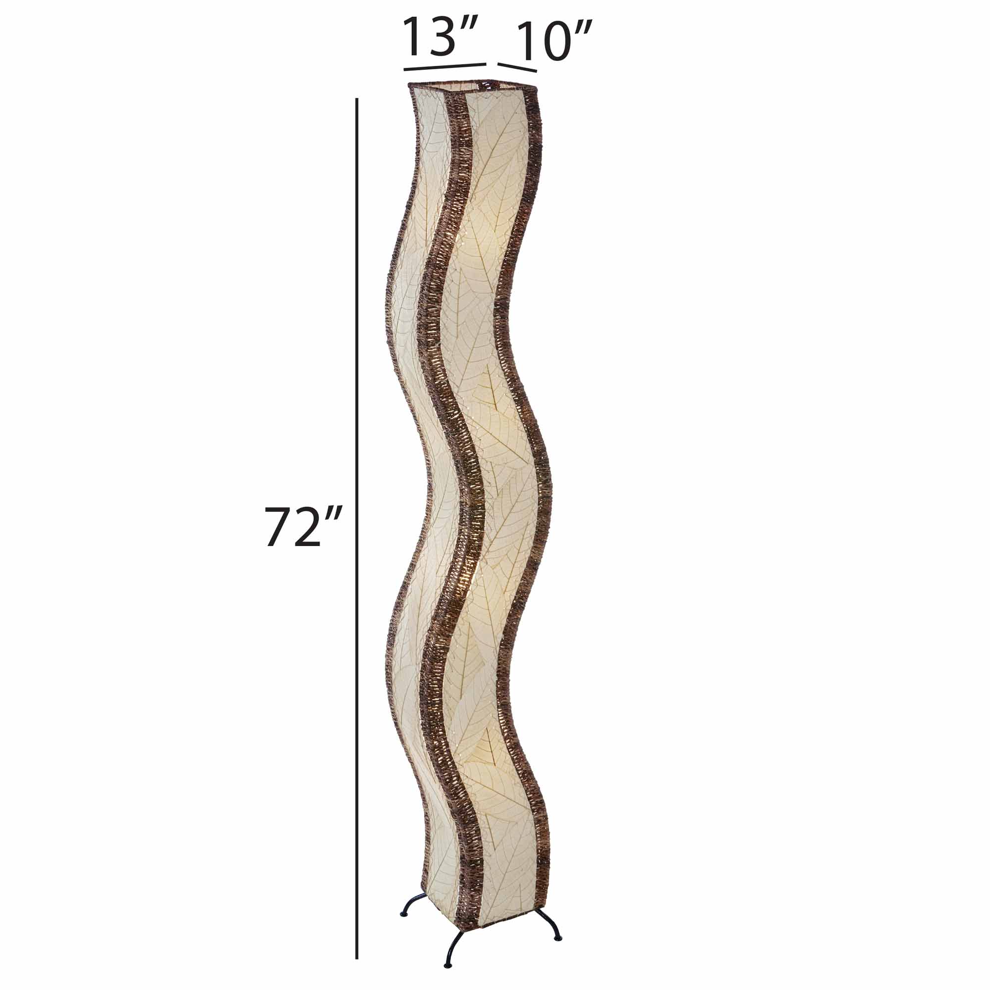 The Eangee Home Design Wave Giant Floor Lamp Natural (Item #457 xl n) features a tall, wavy beige surface with brown abaca rope edges, standing stylishly in a modern living room by plants, shelves of decor, and a gray counter.