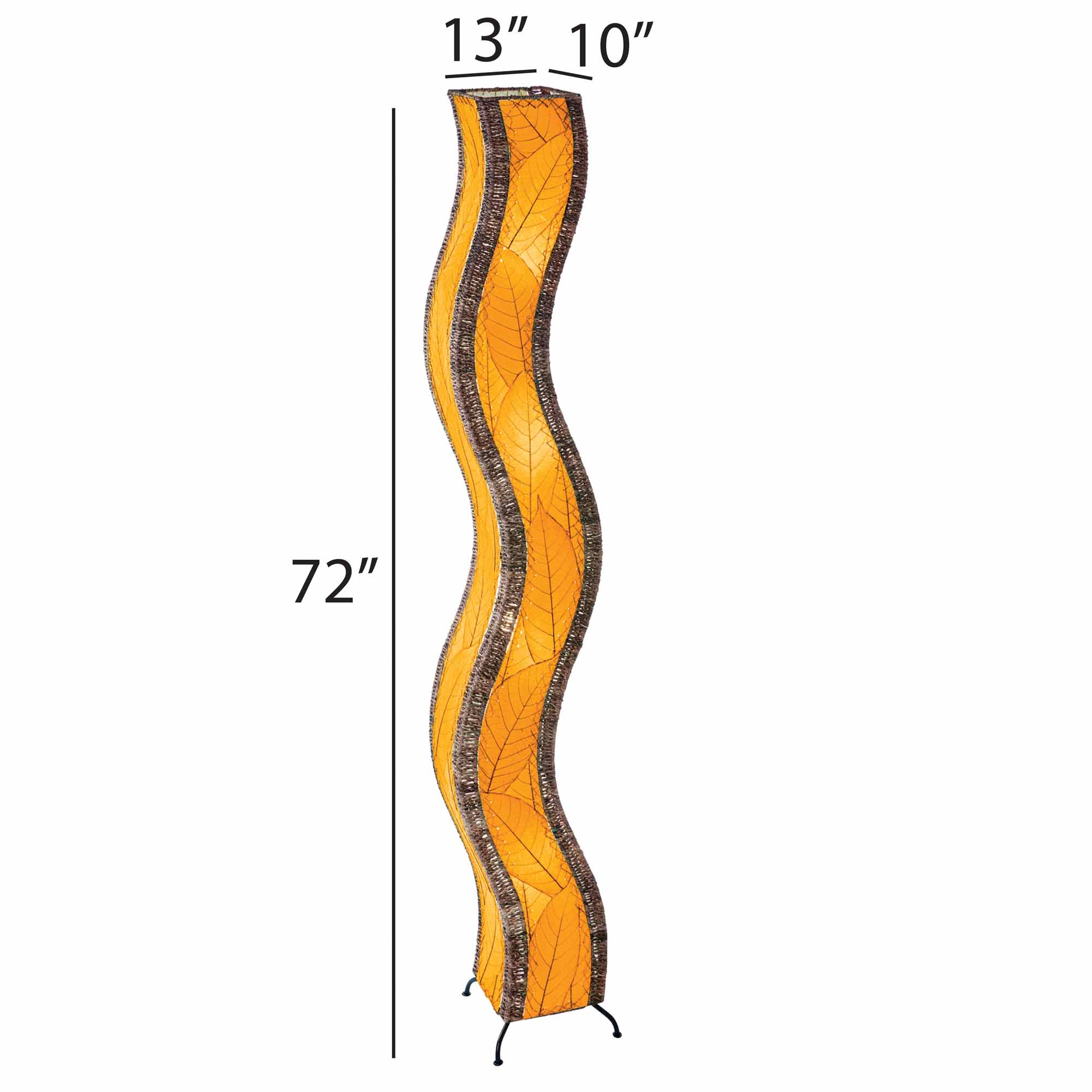 The Eangee Home Design Wave Giant Floor Lamp Orange (Item #457 xl o), featuring brown edges, stands on a light wood floor near a green plant, with shelves of colorful glass bottles and a gray counter in the background.
