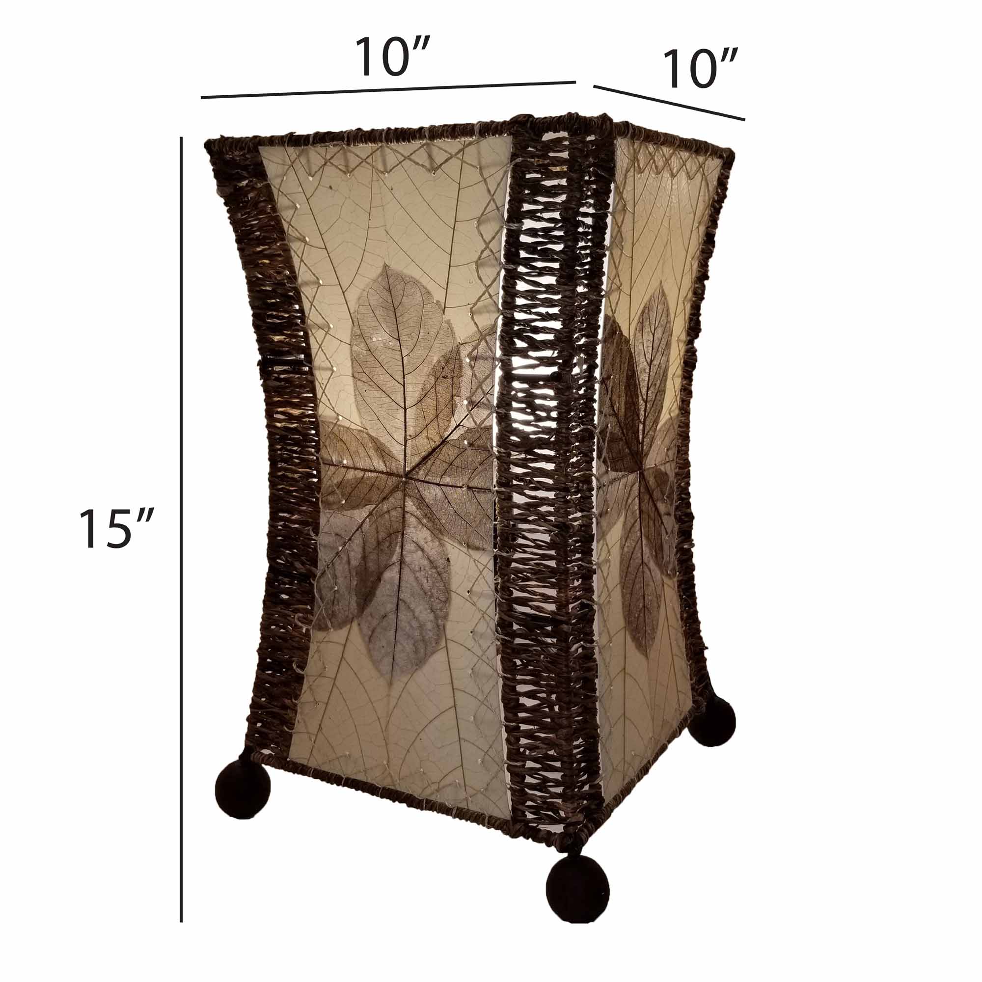 Crafted by the artisans of Eangee Home Design, the Hourglass Table Lamp in natural against a clean backdrop, featuring jackfruit leaf panels, abaca rope accents, wrought iron frame, eco friendly.