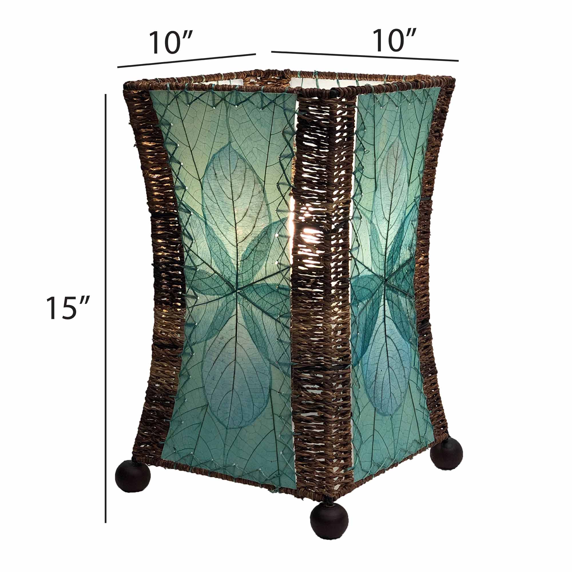 Crafted by the artisans of Eangee Home Design, the Hourglass Table Lamp in sea blue against a clean backdrop, featuring jackfruit leaf panels, abaca rope accents, wrought iron frame, eco friendly.