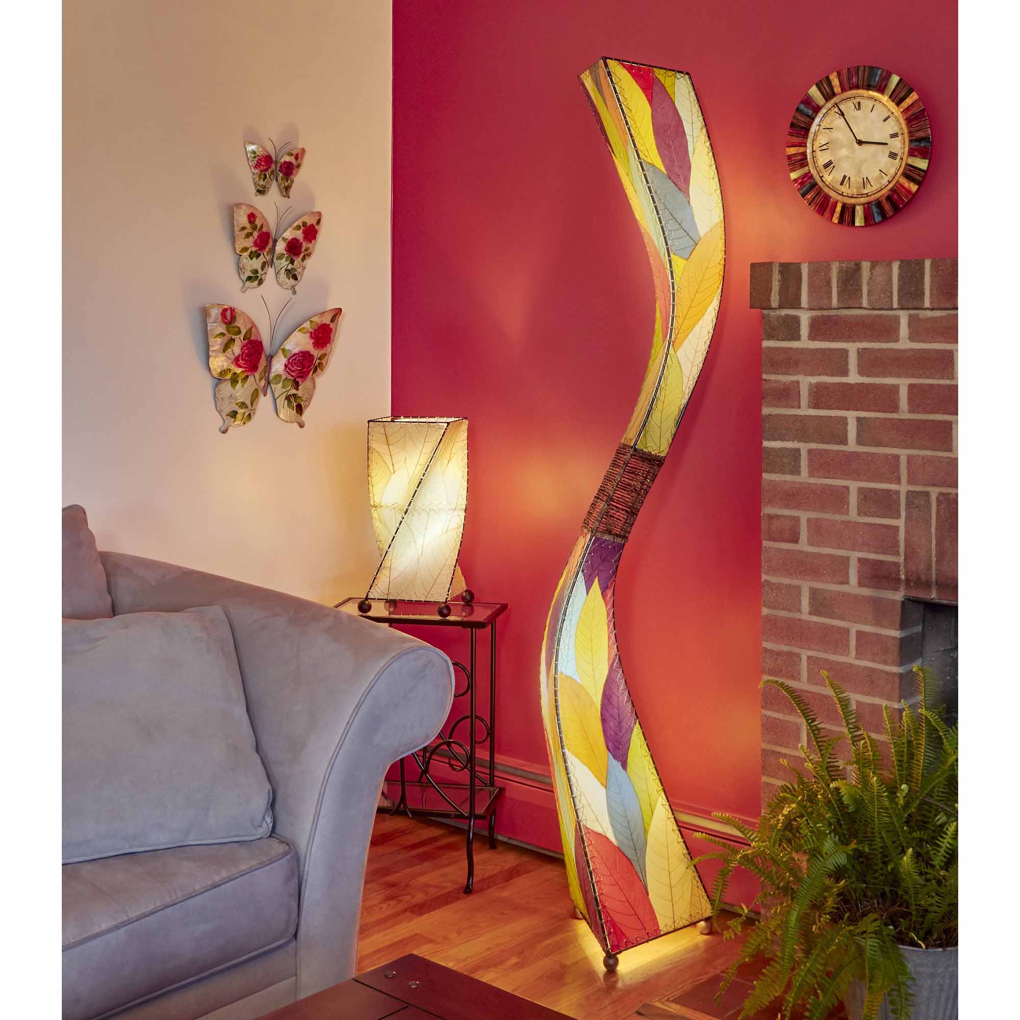 In a coastal inspired living room, crafted by the artisans of Eangee Home Design, the Flow Giant Floor Lamp in multi color stands gracefully, featuring fossilized cocoa leaf shade, abaca rope accents, eco friendly, adding warmth and character to the space.
