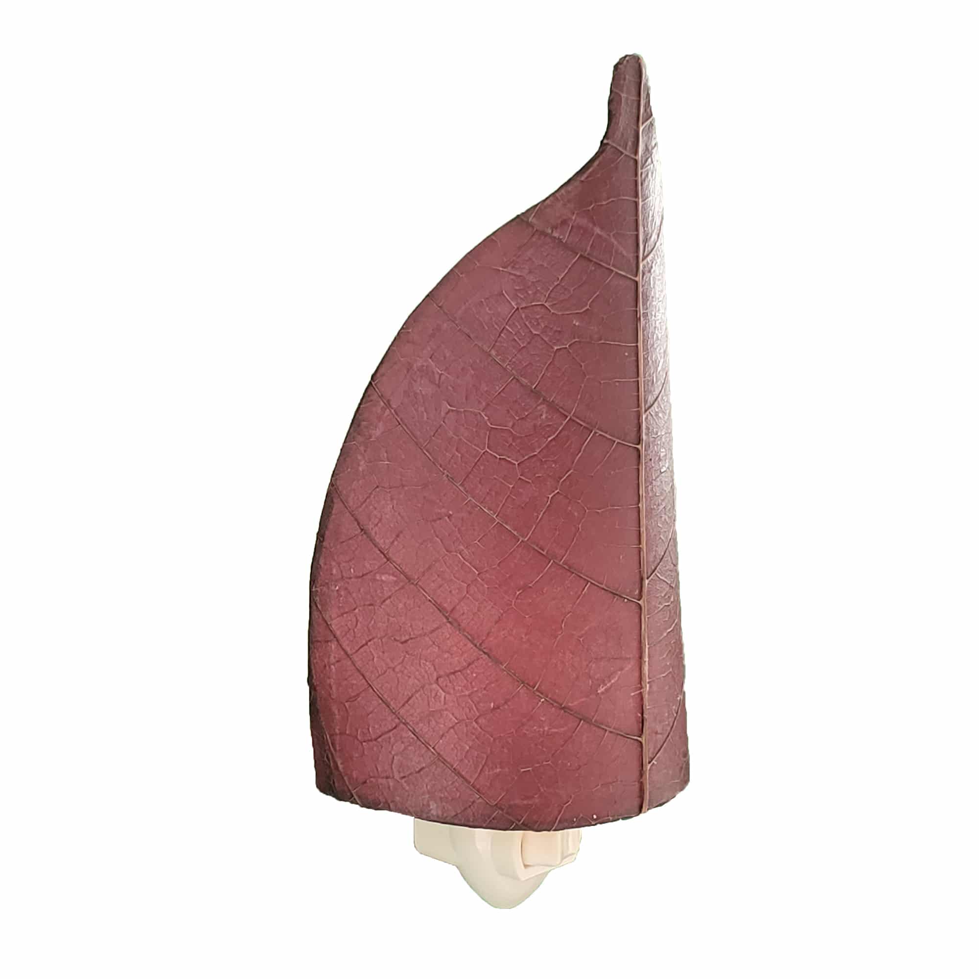 Crafted by the artisans of Eangee Home Design, the Leaf Nightlight in purple against a clean backdrop, featuring fossilized cocoa leaf shade, eco friendly, handcrafted.