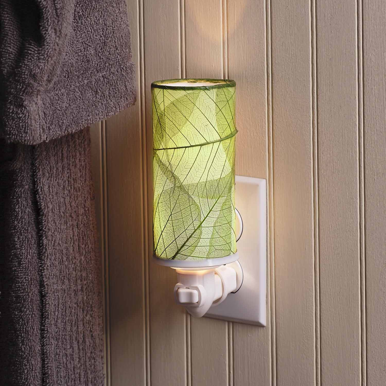 Crafted by the artisans of Eangee Home Design, the Cylinder Nightlight in green against a clean backdrop, featuring handcrafted detailing, fair trade, eco friendly.