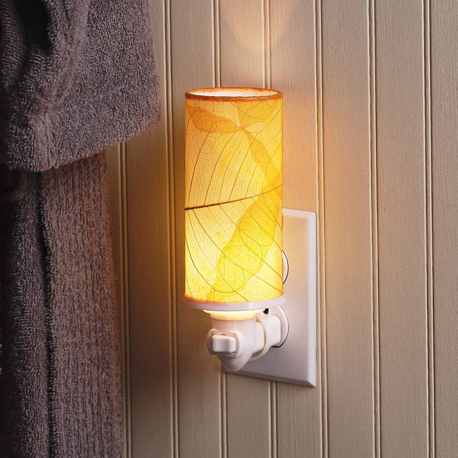 Crafted by the artisans of Eangee Home Design, the Cylinder Nightlight in orange against a clean backdrop, featuring handcrafted detailing, fair trade, eco friendly.
