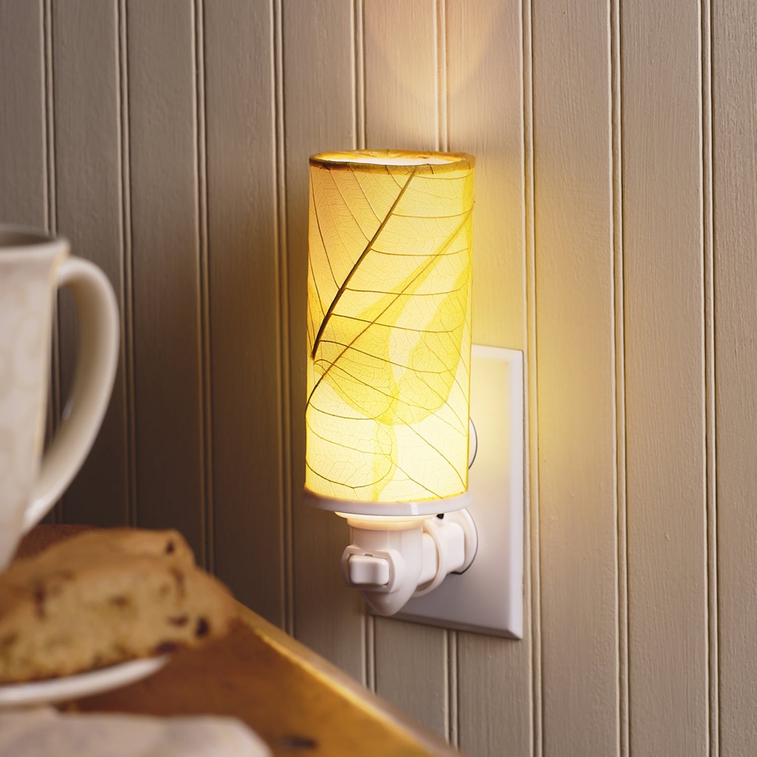 Crafted by the artisans of Eangee Home Design, the Cylinder Nightlight in yellow against a clean backdrop, featuring handcrafted detailing, fair trade, eco friendly.