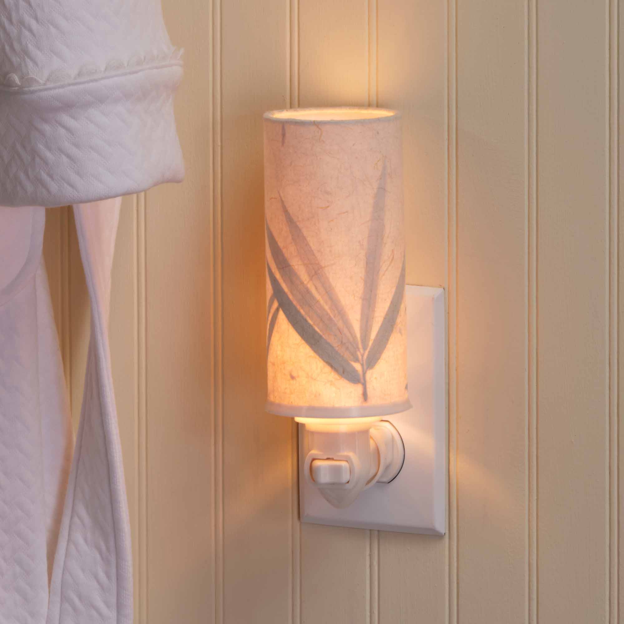 Crafted by the artisans of Eangee Home Design, the Paper Nightlight Bamboo in natural against a clean backdrop, featuring recycled paper shade, sustainably sourced, handcrafted, recycled materials.