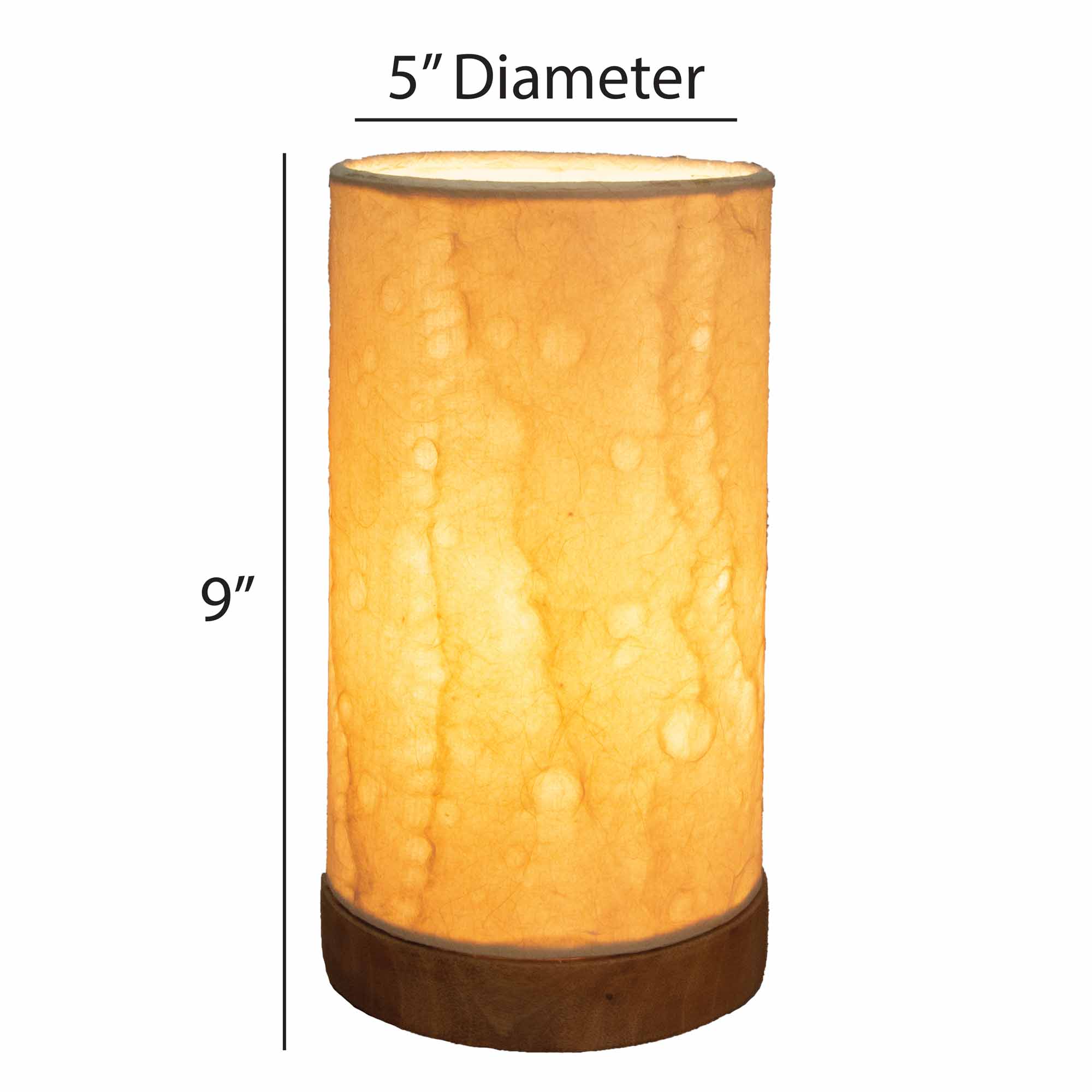 Crafted by the artisans of Eangee Home Design, the Mini Paper Cylinder Table Lamp Wave in natural against a clean backdrop, featuring reclaimed mango wood base, recycled paper shade, sustainably sourced, recycled materials.