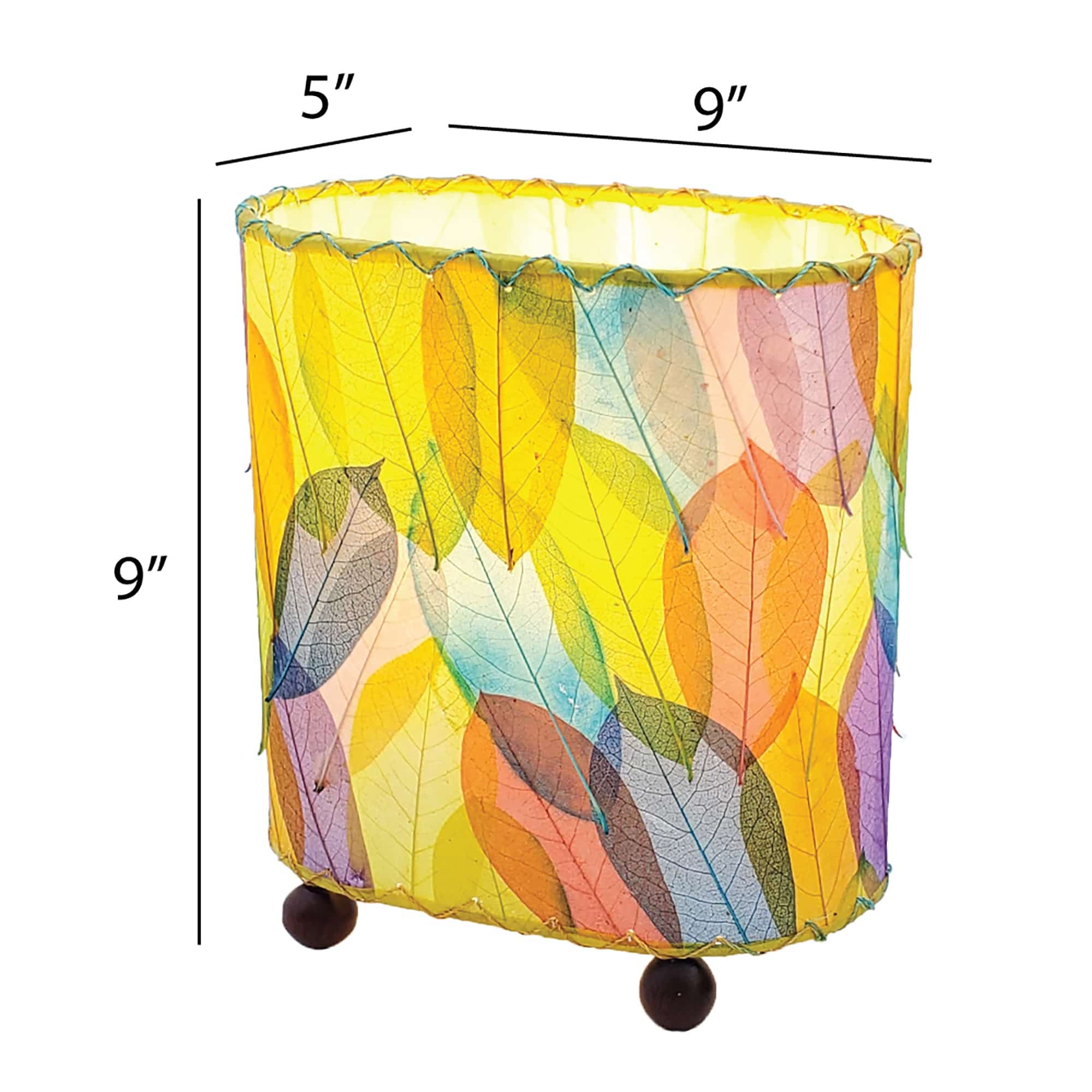 Crafted by the artisans of Eangee Home Design, the Mini Guyabano Table Lamp in multi color against a clean backdrop, featuring fossilized cocoa leaf shade, guyabano leaf shade, wrought iron frame.