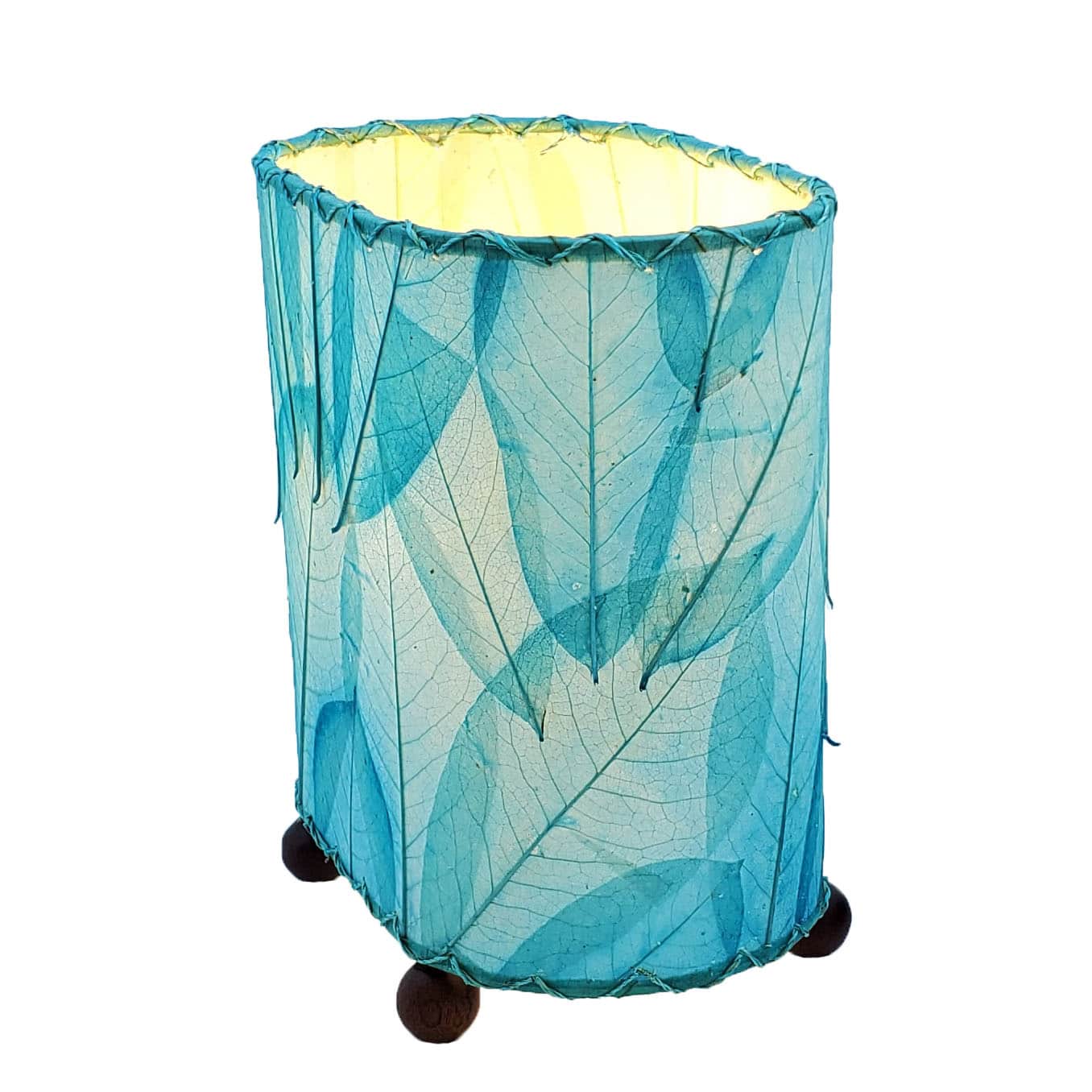 Crafted by the artisans of Eangee Home Design, the Mini Guyabano Table Lamp in sea blue against a clean backdrop, featuring fossilized cocoa leaf shade, guyabano leaf shade, wrought iron frame.