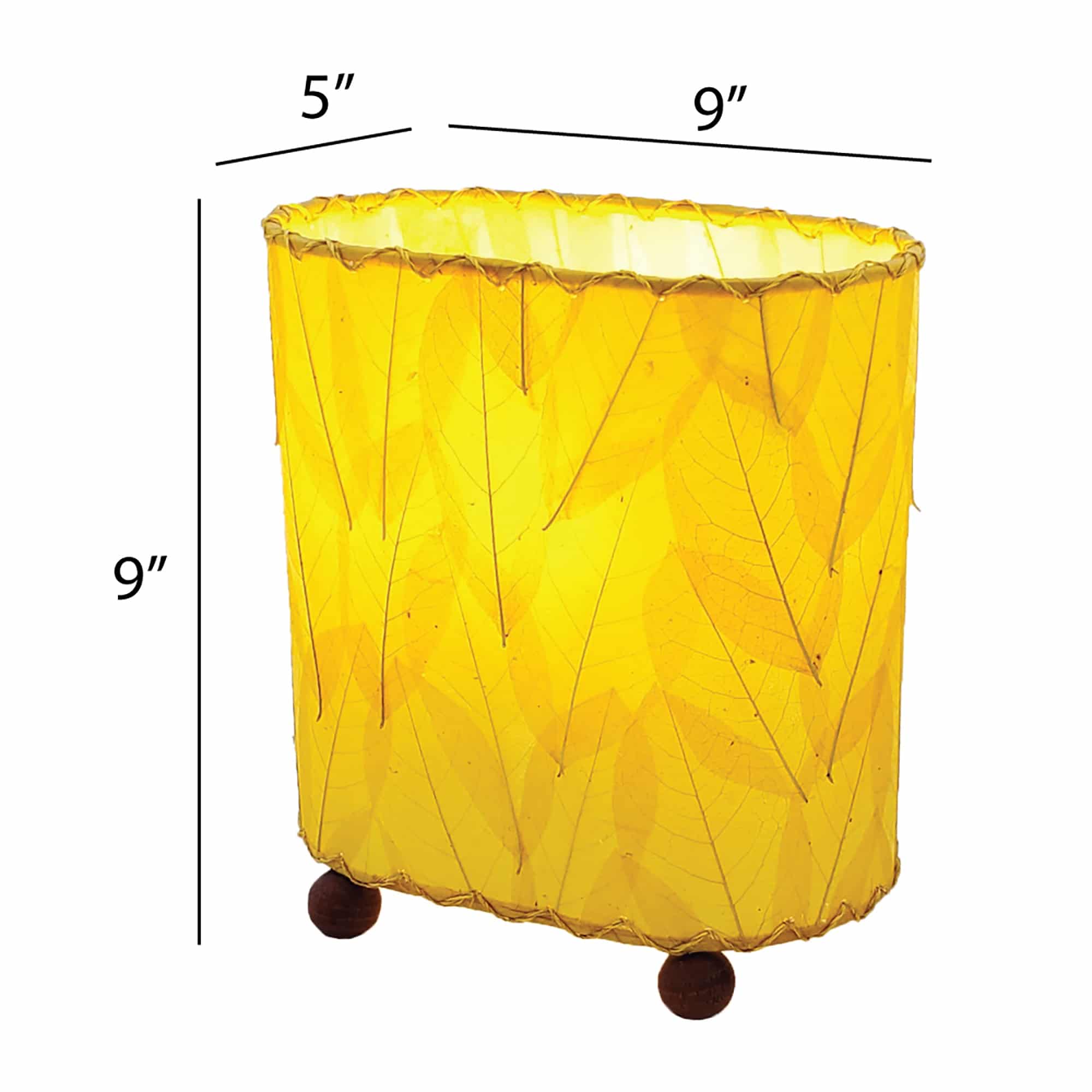 Crafted by the artisans of Eangee Home Design, the Mini Guyabano Table Lamp in yellow against a clean backdrop, featuring fossilized cocoa leaf shade, guyabano leaf shade, wrought iron frame.