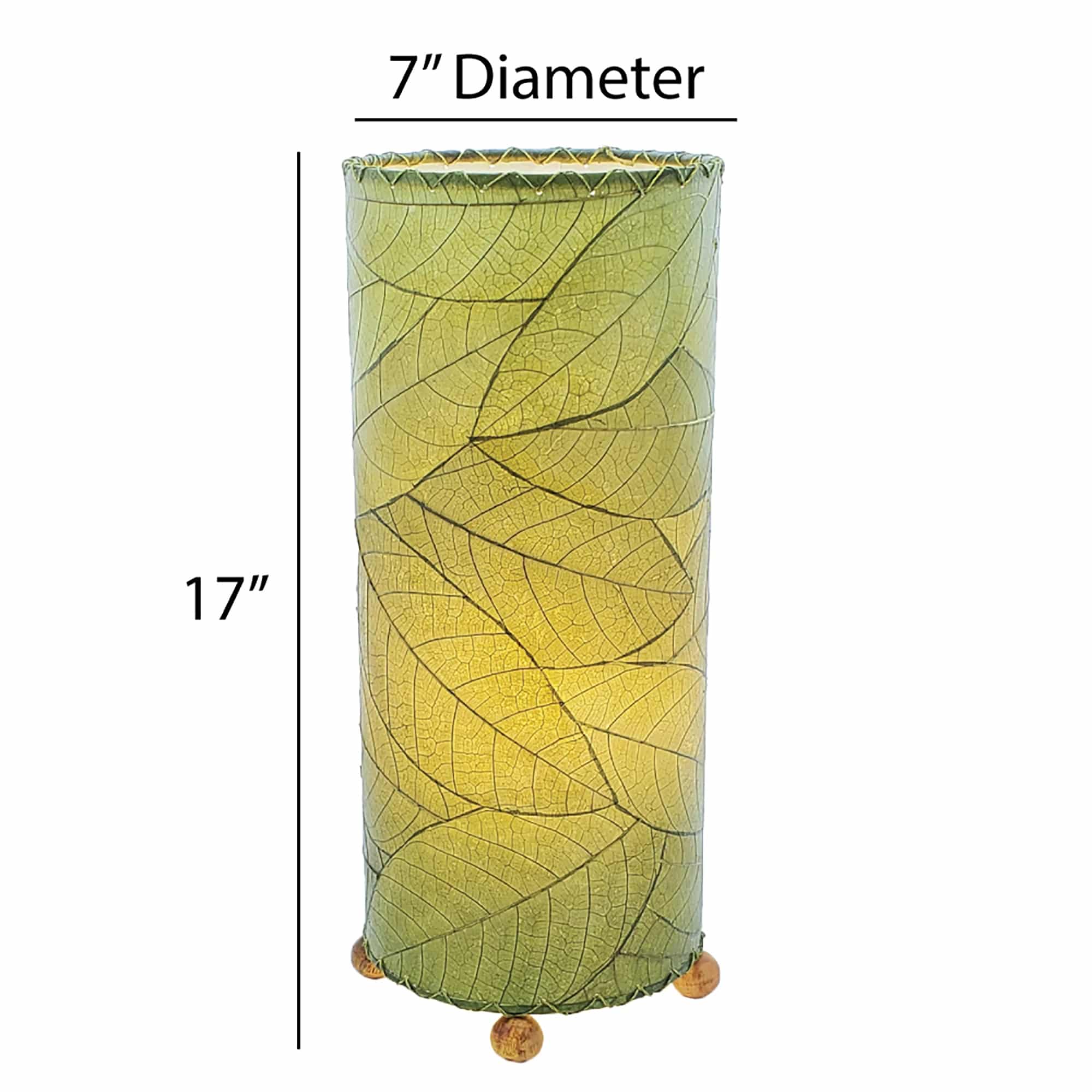 Crafted by the artisans of Eangee Home Design, the Cocoa Leaf Cylinder Table Lamp in green against a clean backdrop, featuring fossilized cocoa leaf shade, wrought iron frame, handcrafted.