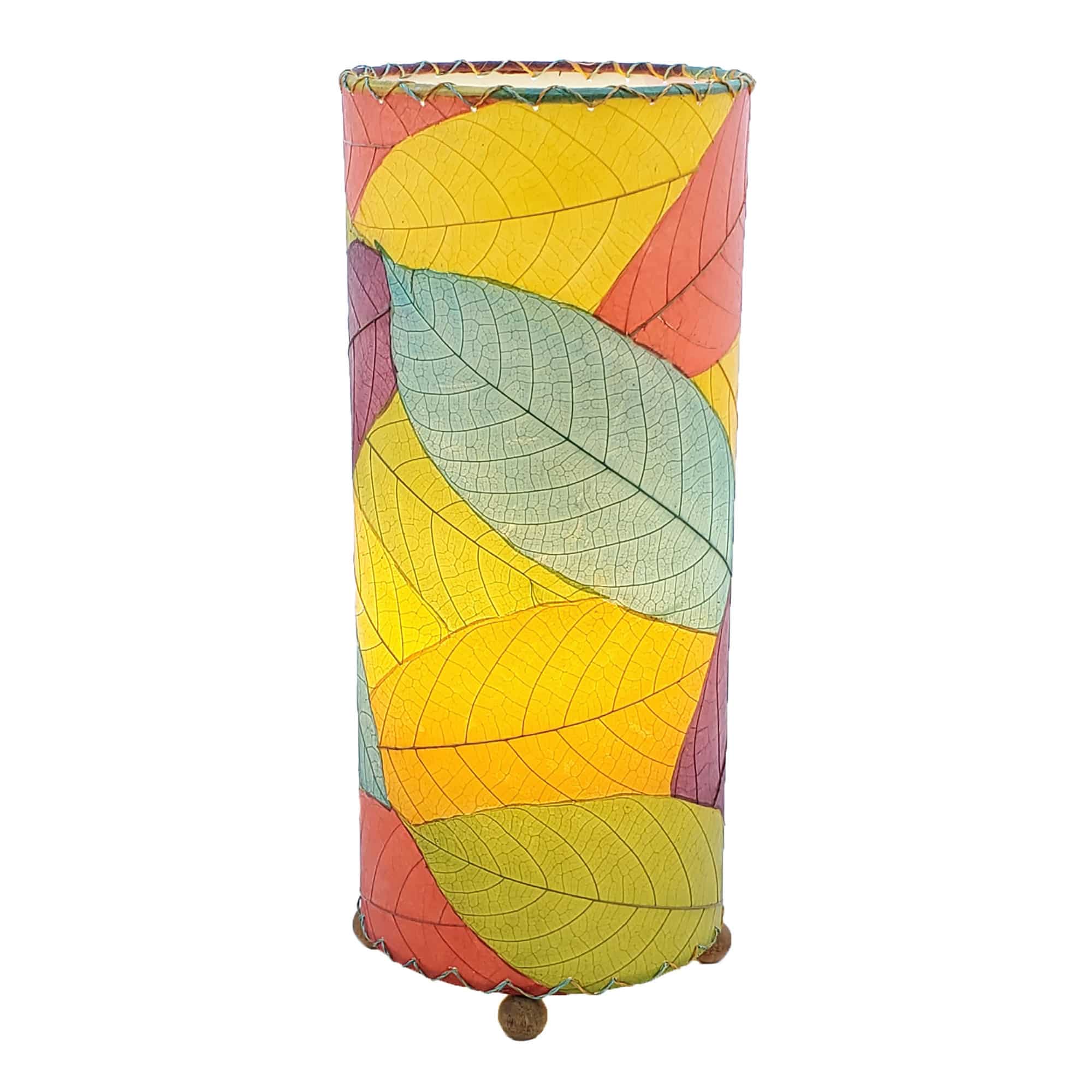 Crafted by the artisans of Eangee Home Design, the Cocoa Leaf Cylinder Table Lamp in multi color against a clean backdrop, featuring fossilized cocoa leaf shade, wrought iron frame, handcrafted.