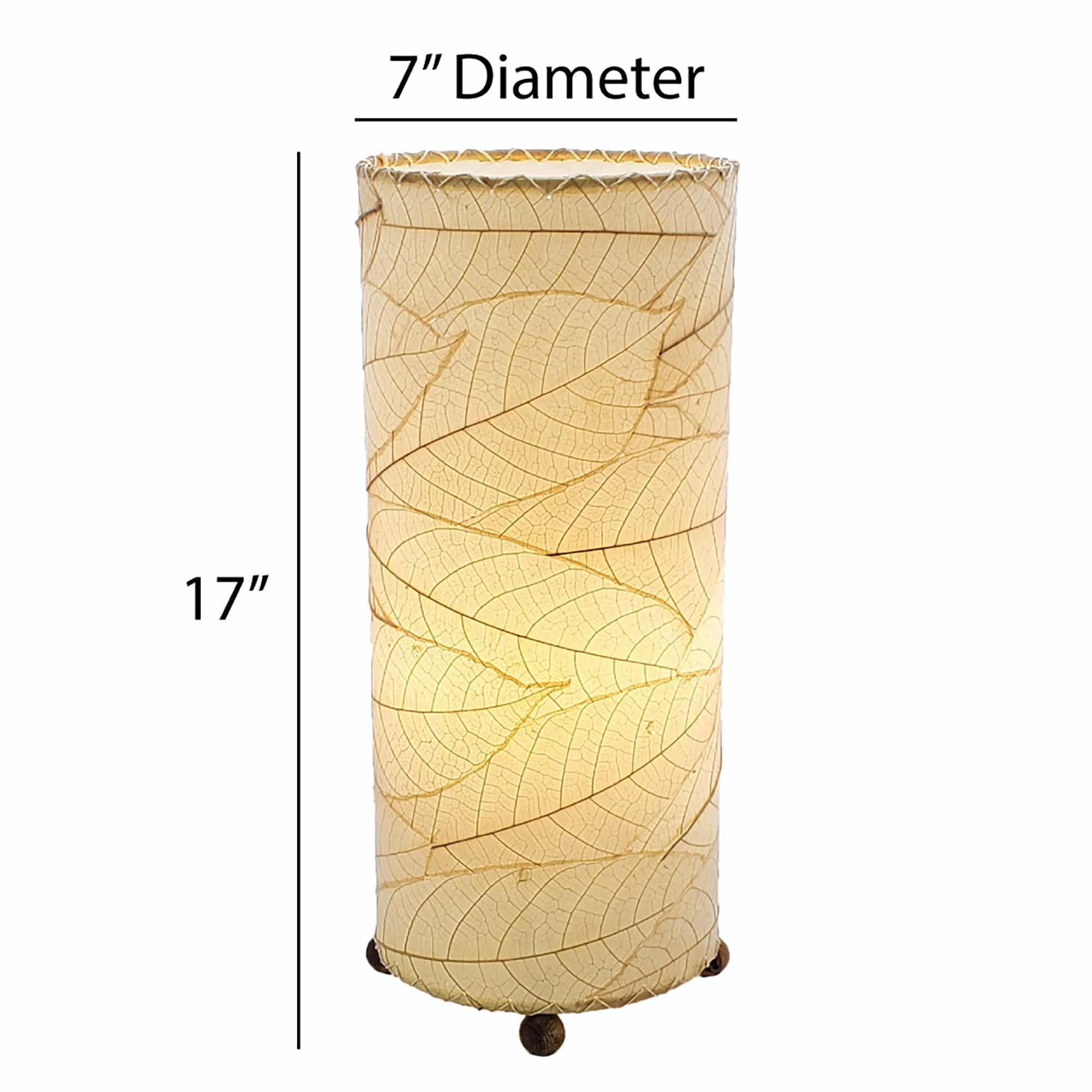 Crafted by the artisans of Eangee Home Design, the Cocoa Leaf Cylinder Table Lamp in natural against a clean backdrop, featuring fossilized cocoa leaf shade, wrought iron frame, handcrafted.