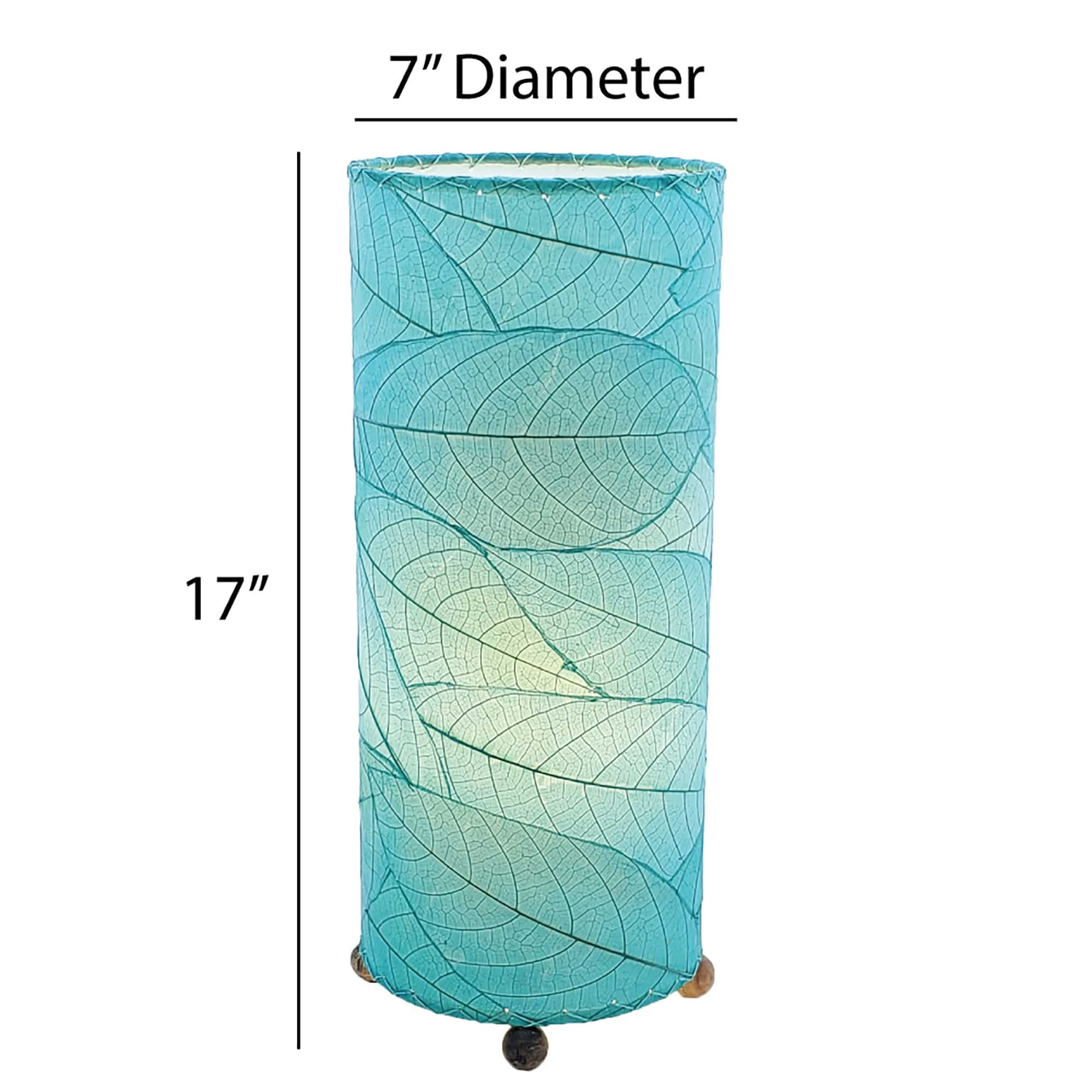 Crafted by the artisans of Eangee Home Design, the Cocoa Leaf Cylinder Table Lamp in sea blue against a clean backdrop, featuring fossilized cocoa leaf shade, wrought iron frame, handcrafted.