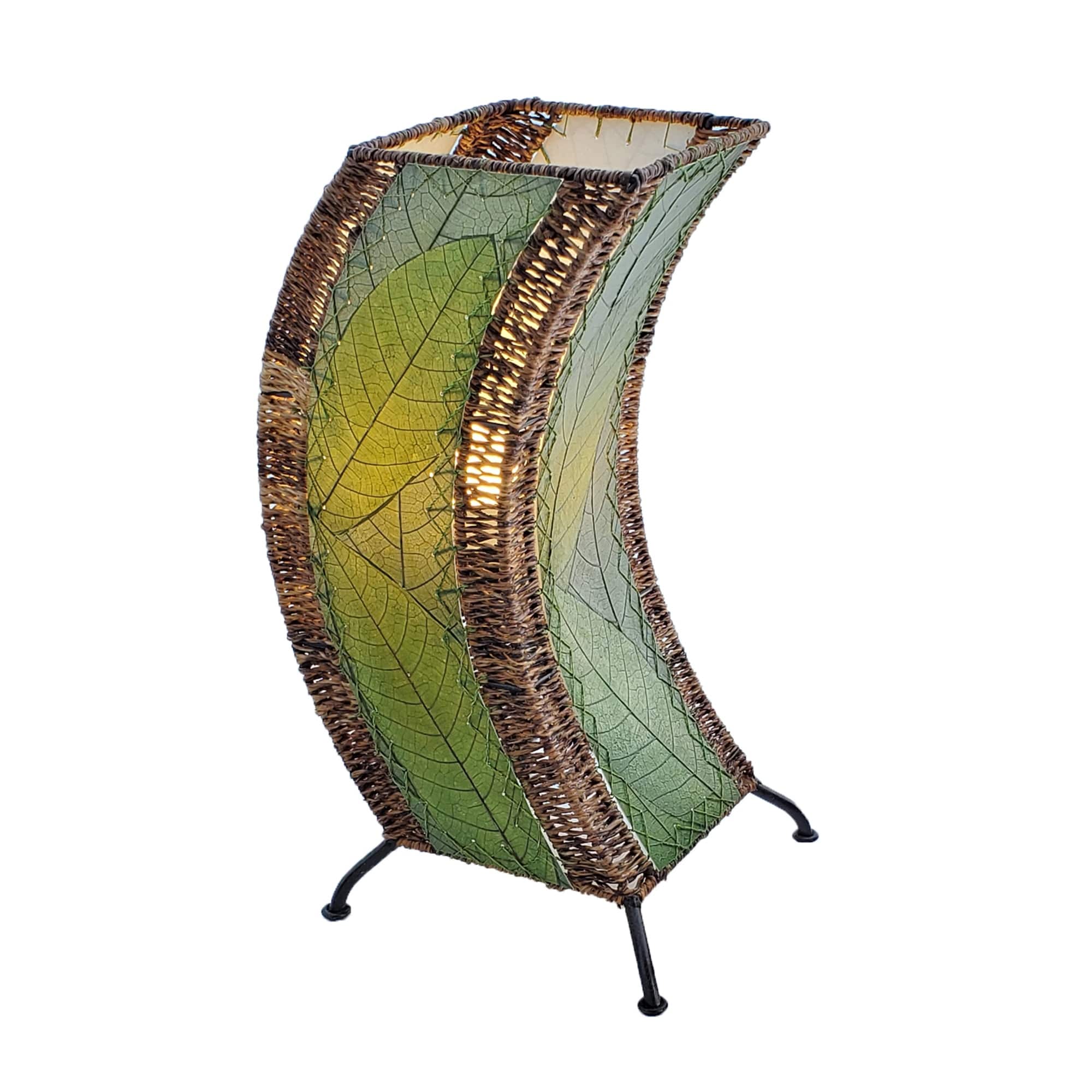 Crafted by the artisans of Eangee Home Design, the C Shape Table Lamp in green against a clean backdrop, featuring fossilized cocoa leaf shade, abaca rope accents, fair trade, handcrafted.