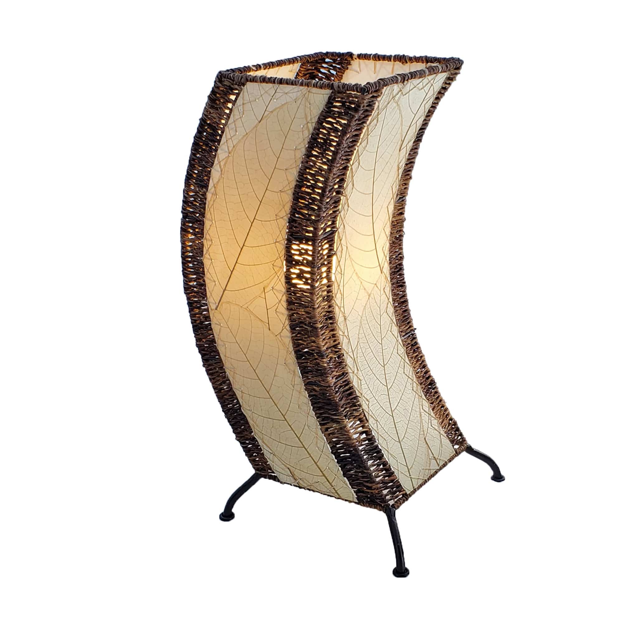 Crafted by the artisans of Eangee Home Design, the C Shape Table Lamp in natural against a clean backdrop, featuring fossilized cocoa leaf shade, abaca rope accents, fair trade, handcrafted.
