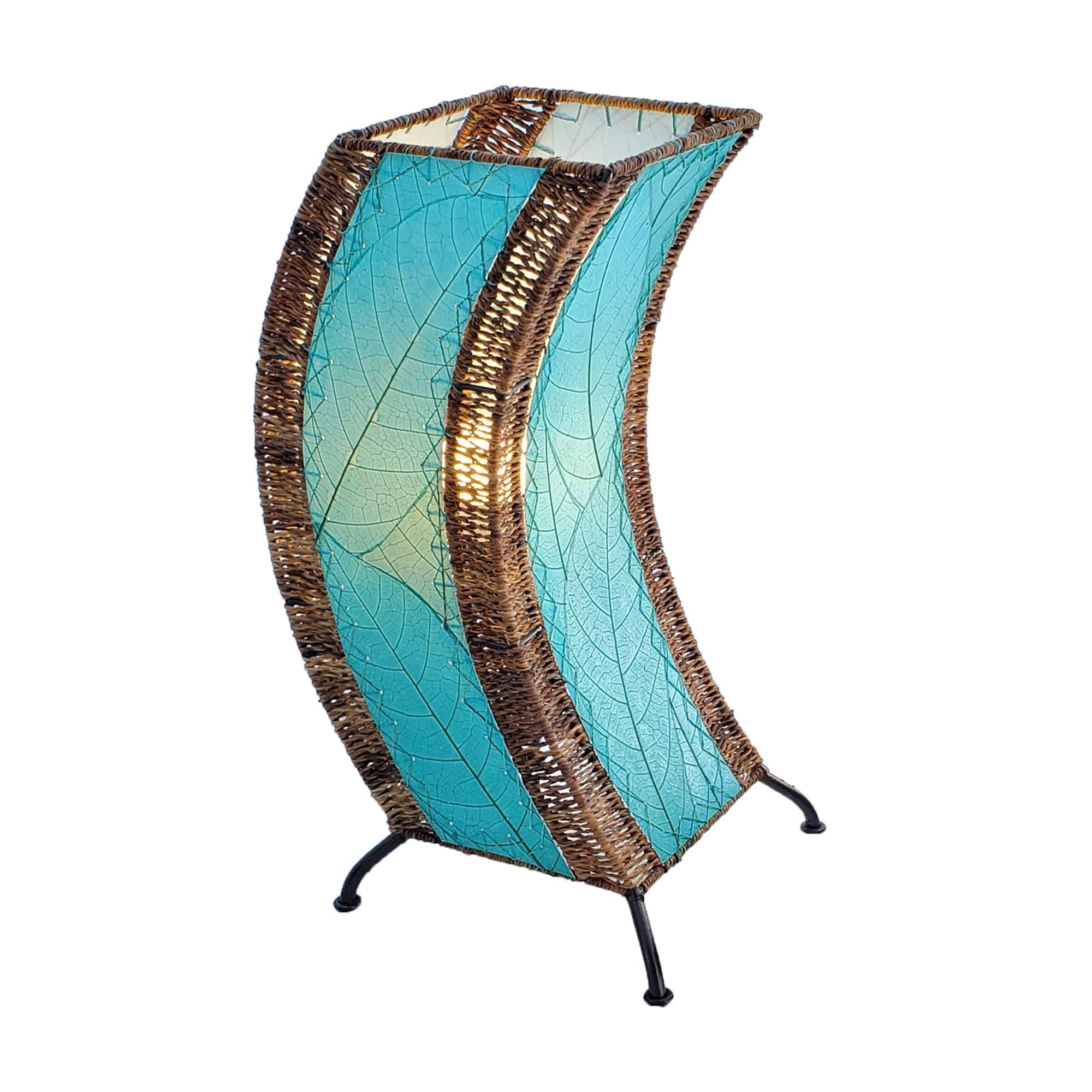 Crafted by the artisans of Eangee Home Design, the C Shape Table Lamp in sea blue against a clean backdrop, featuring fossilized cocoa leaf shade, abaca rope accents, fair trade, handcrafted.