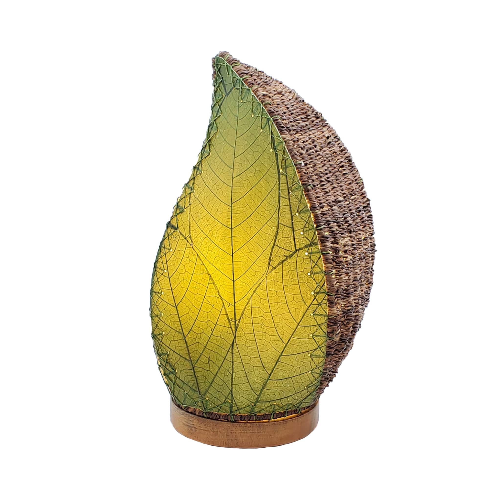 Crafted by the artisans of Eangee Home Design, the Leaflet Table Lamp in green against a clean backdrop, featuring fossilized cocoa leaf shade, abaca rope accents, reclaimed mango wood base, wrought iron frame, sustainably sourced.