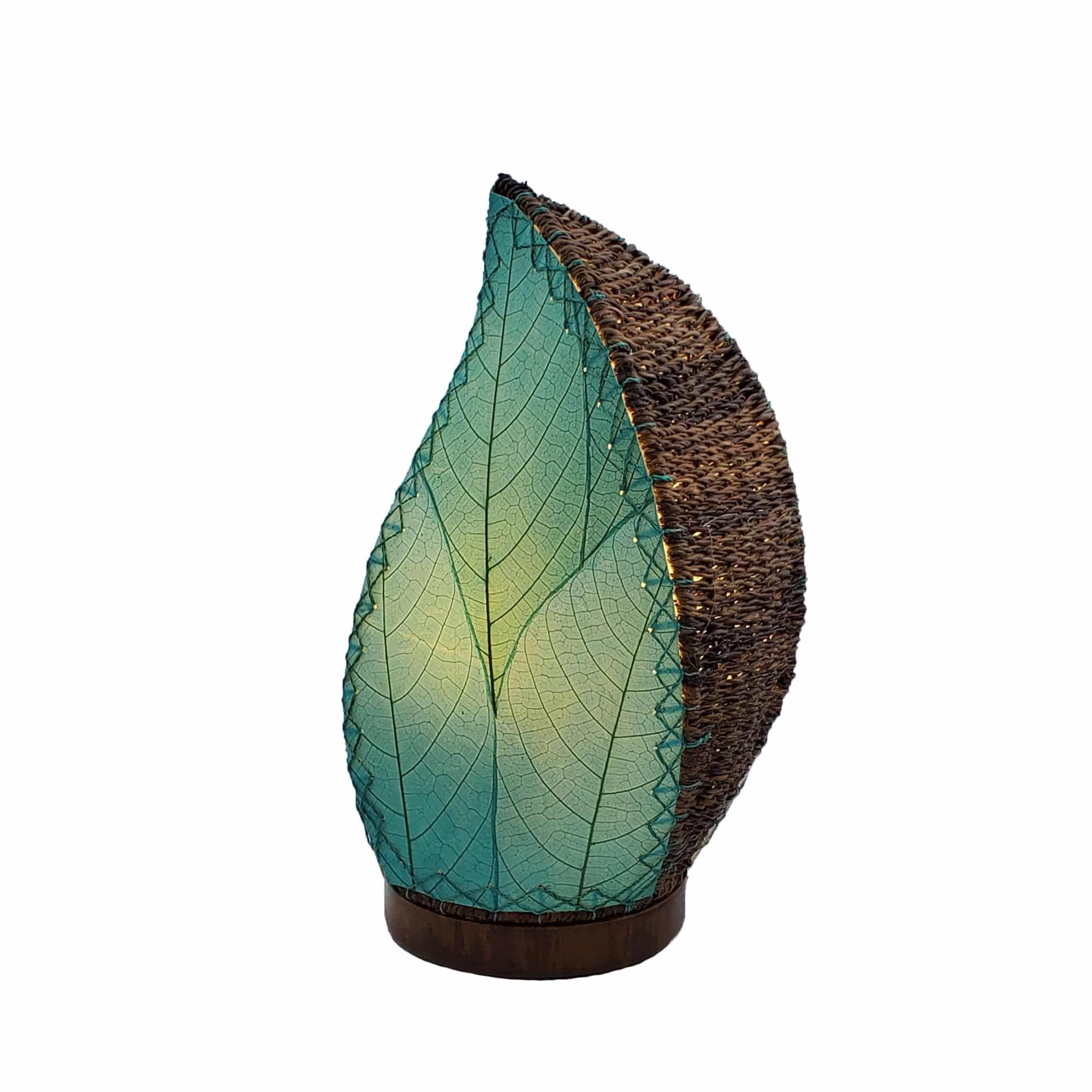 Crafted by the artisans of Eangee Home Design, the Leaflet Table Lamp in sea blue against a clean backdrop, featuring fossilized cocoa leaf shade, abaca rope accents, reclaimed mango wood base, wrought iron frame, sustainably sourced.