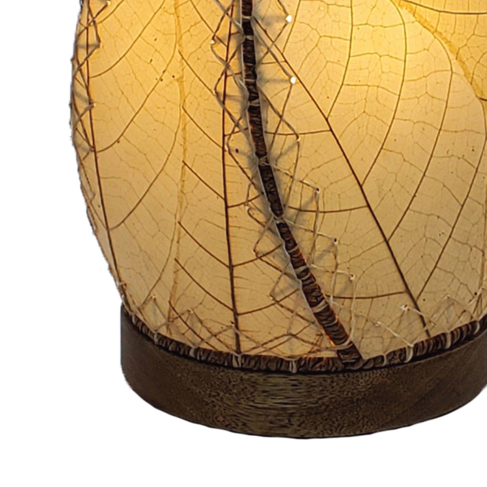 Crafted by the artisans of Eangee Home Design, the Leaflet Table Lamp in natural against a clean backdrop, featuring fossilized cocoa leaf shade, abaca rope accents, reclaimed mango wood base, wrought iron frame, sustainably sourced.