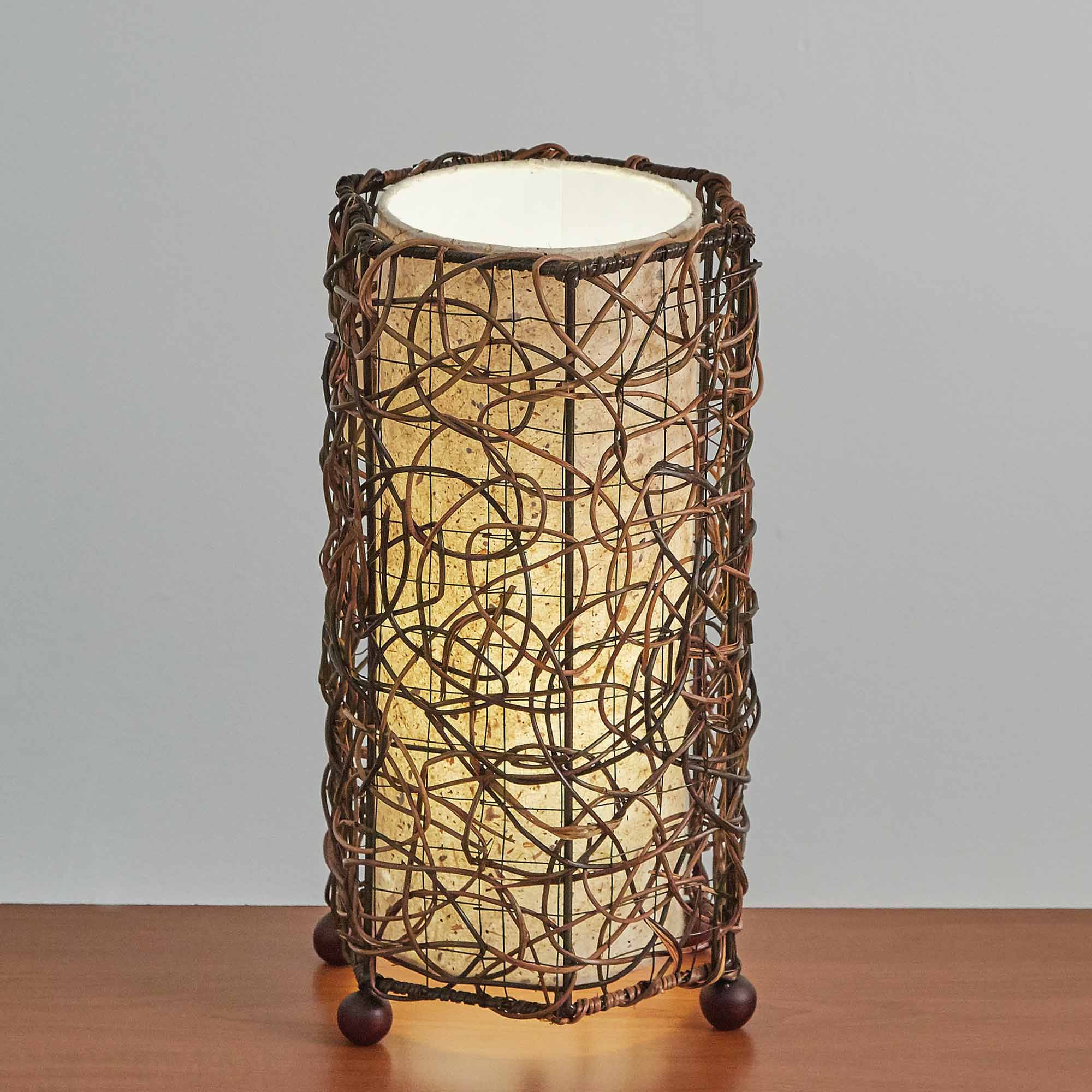 Crafted by the artisans of Eangee Home Design, the Nito Table Lamp in natural against a clean backdrop, featuring recycled paper shade, sustainably sourced.