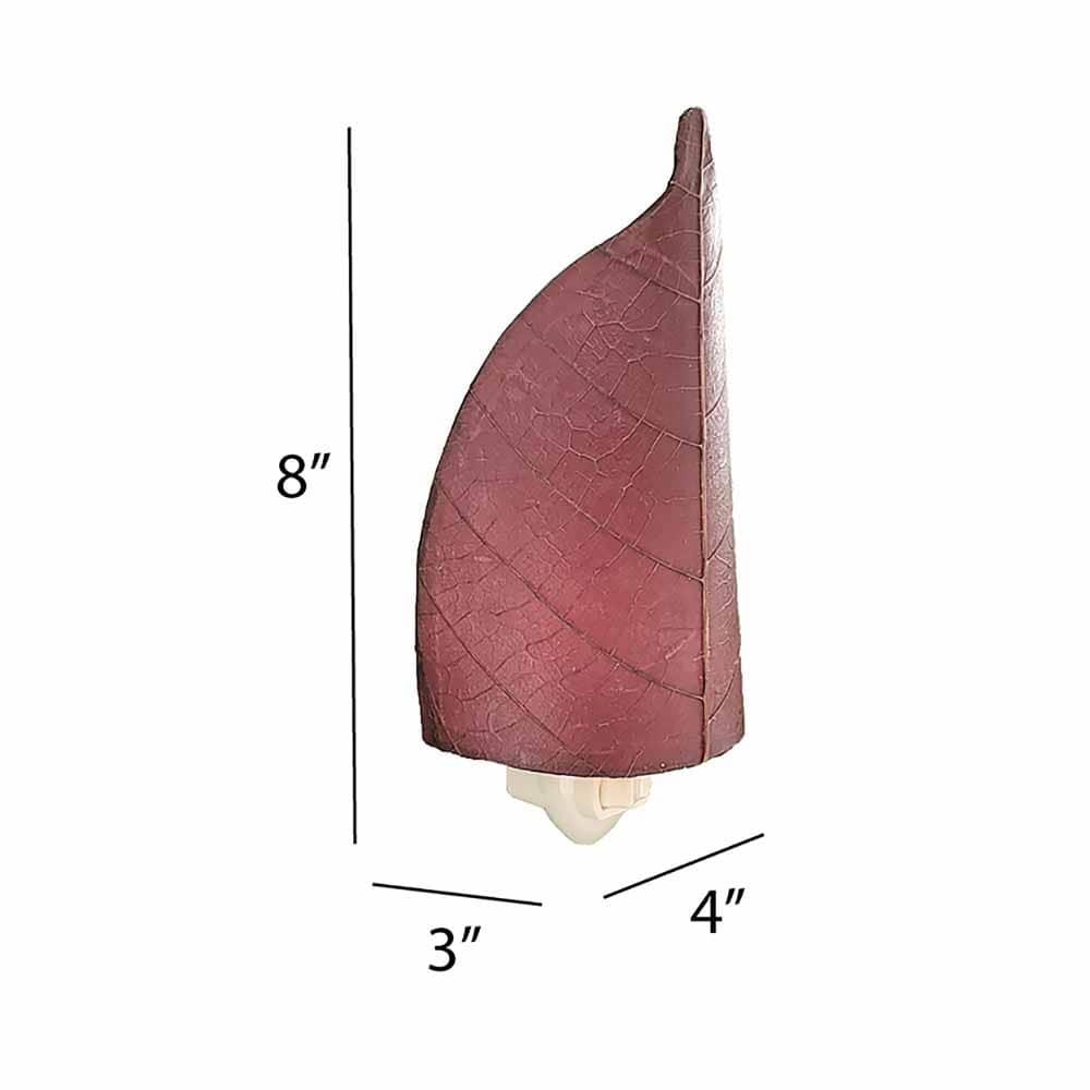 The Leaf Nightlight in purple finish by Eangee Home Design displayed against a white background highlights its fossilized cocoa leaf panels and hand placed natural leaves, designed to the leaf nightlight is a little spark with a lot of soul.