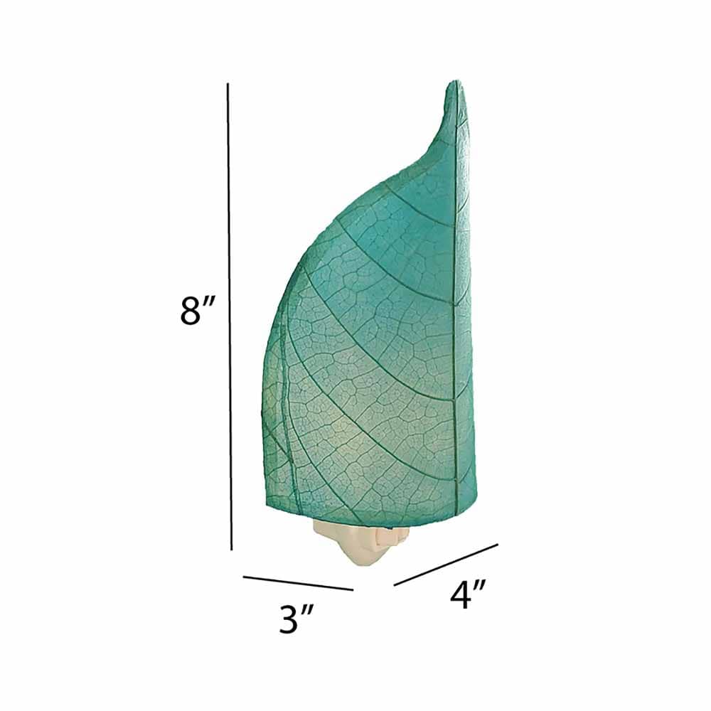 The Leaf Nightlight in sea blue finish by Eangee Home Design displayed against a white background highlights its fossilized cocoa leaf panels and hand placed natural leaves, designed to the leaf nightlight is a little spark with a lot of soul.